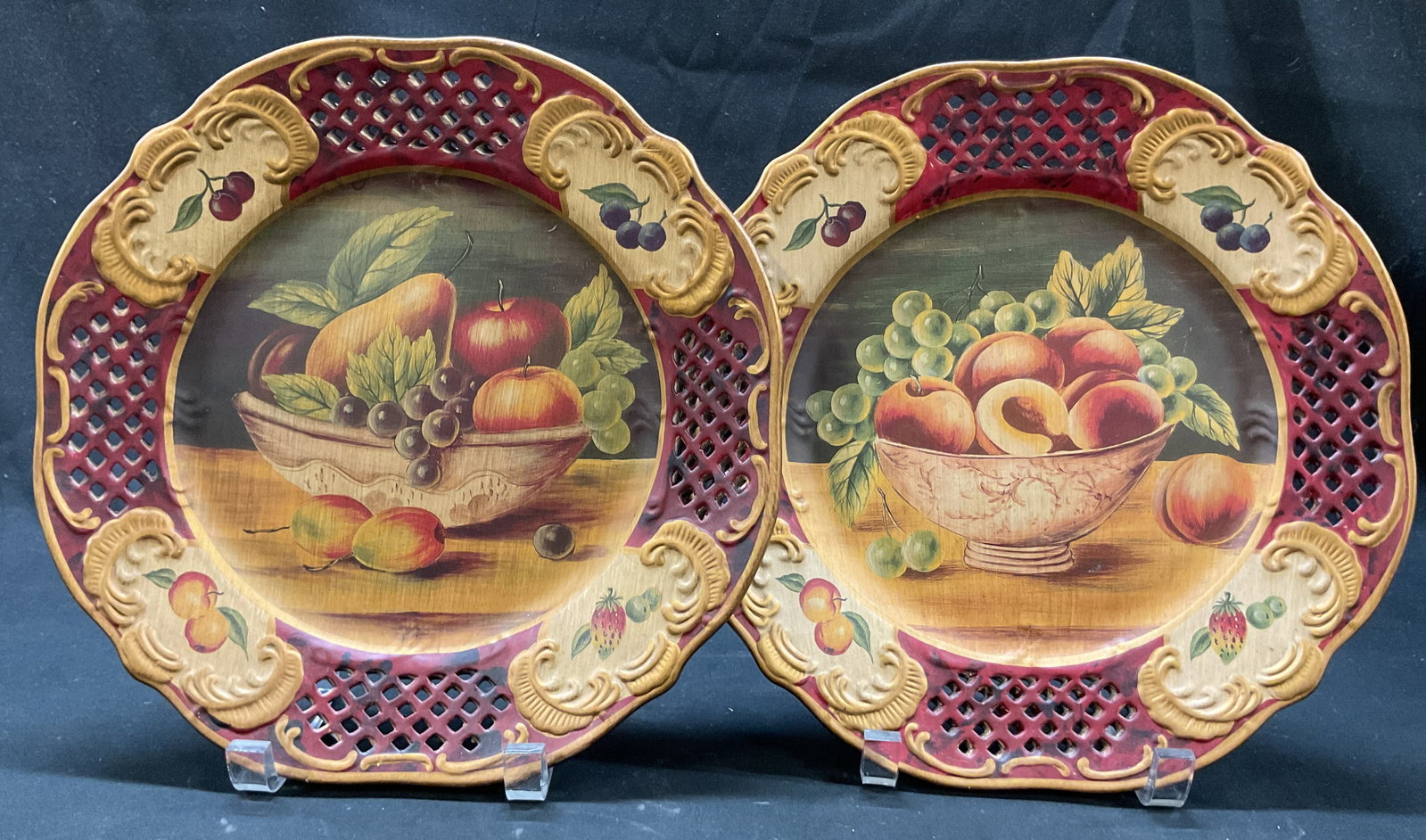 Set 2 Vintage Ceramic Painted Fruit Deco Plates: Lot of 2 vintage ceramic hand painted decorative plates. Round plates with scalloped accents. Hand painted fruit motifs in varying colors. Cut out diamond like pattern accent. Embossed surface with sc