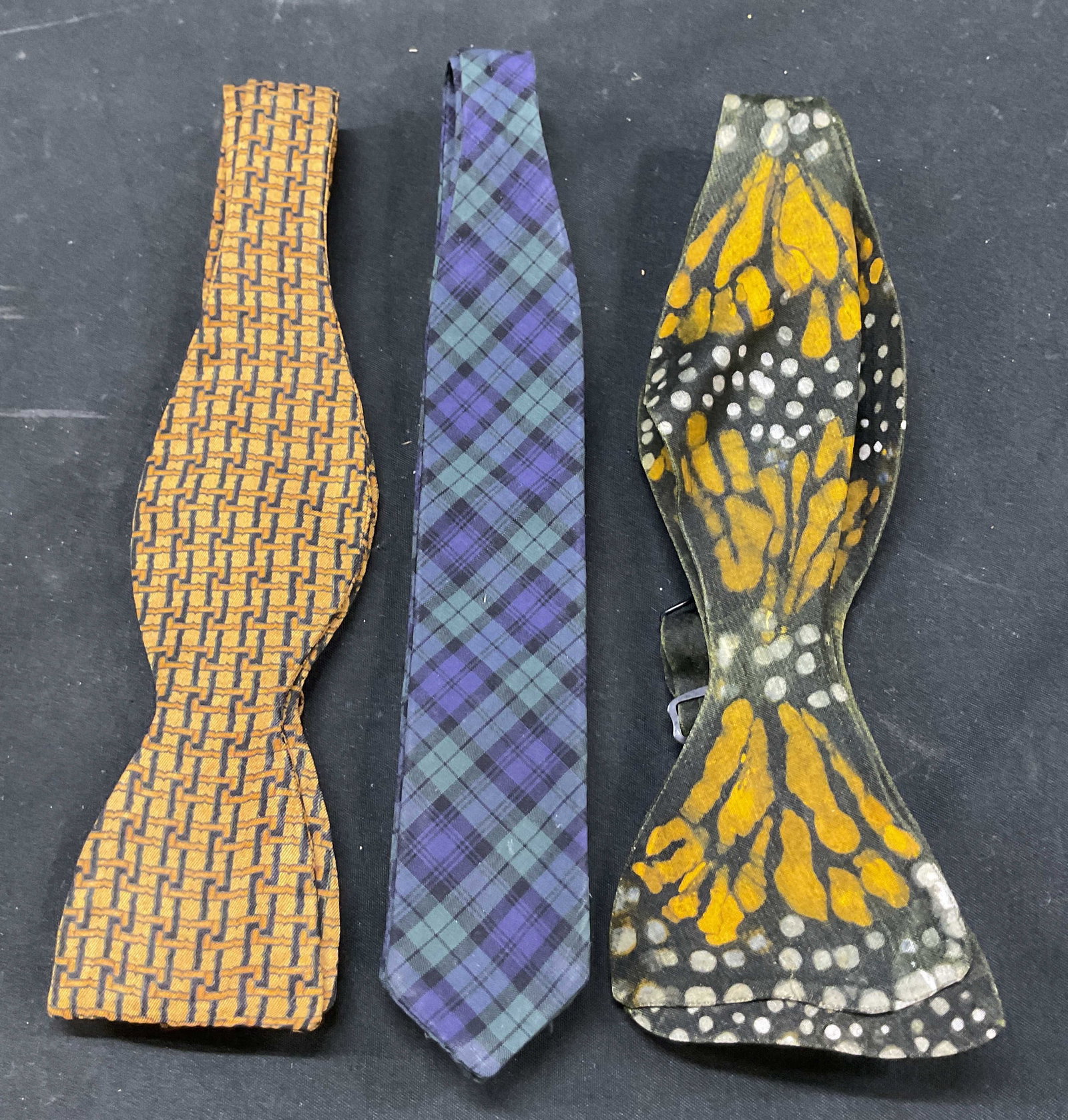 Lot 3 A. Sulka & Company+ Silk Bow Ties: Lot of 3 silk bow ties. One marked A. Sulka & Company for Neusteters Mans Store. Silk material. Varying colors and patterns. Measures approx 2 x 34 inches. Wear consistent with exposure. Bow tie, tie,