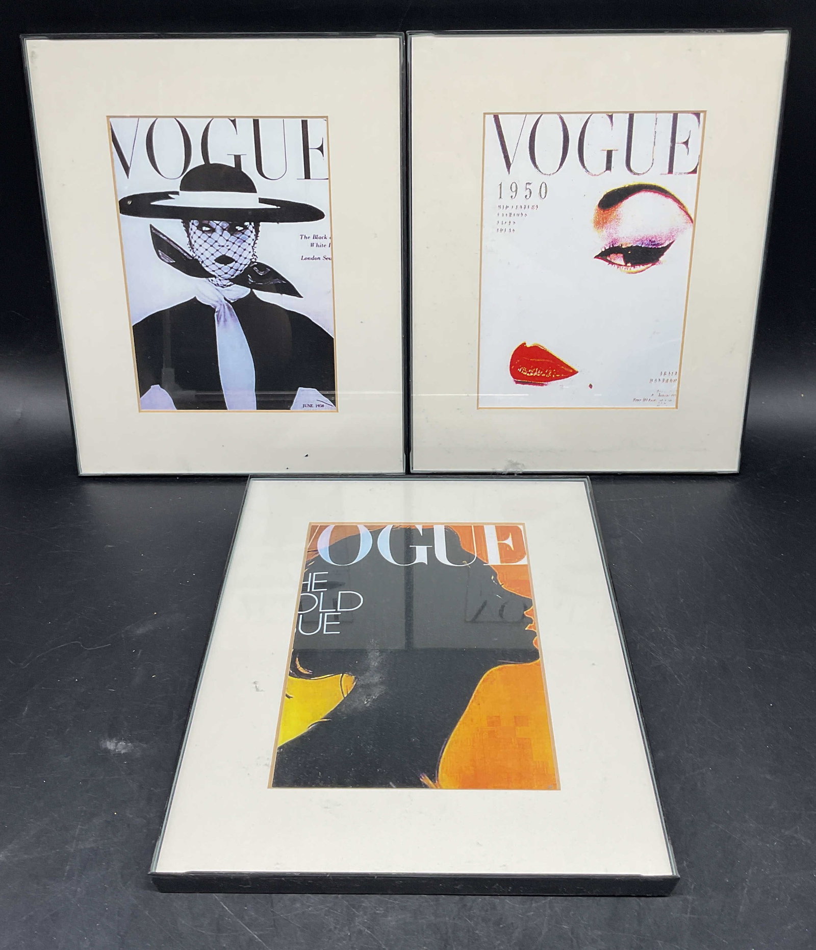 Lot 3 Framed Vogue Cover Lithographs: Lot of 3 framed and matted Vogue cover lithographs. Black frames. Not examined out of frames. Frames measures approx. 10 x 8 inches. Some wear consistent with exposure. Art, framed art, home decor, ho