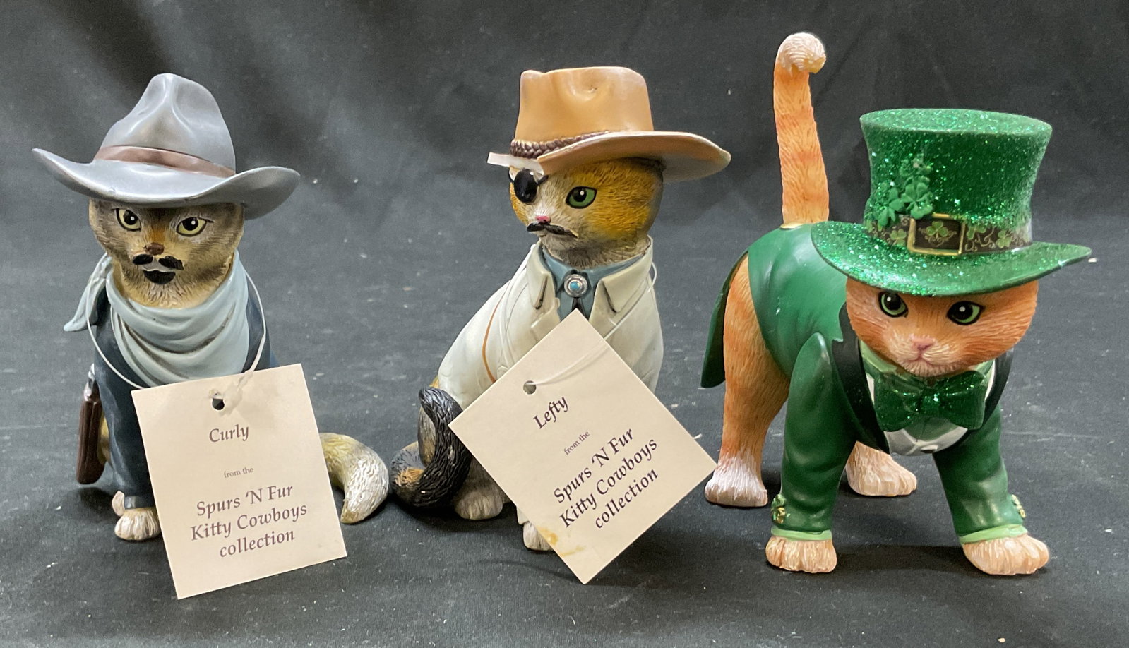 Lot 3 2015 Hamilton Collection Cat Figures+: Lot of 3 resin cat figures. One is dressed up as a leprechaun with a green sparkly top hat and jacket. Hand painted features and details. The other two cat figures are from the Hamilton Collection Spu