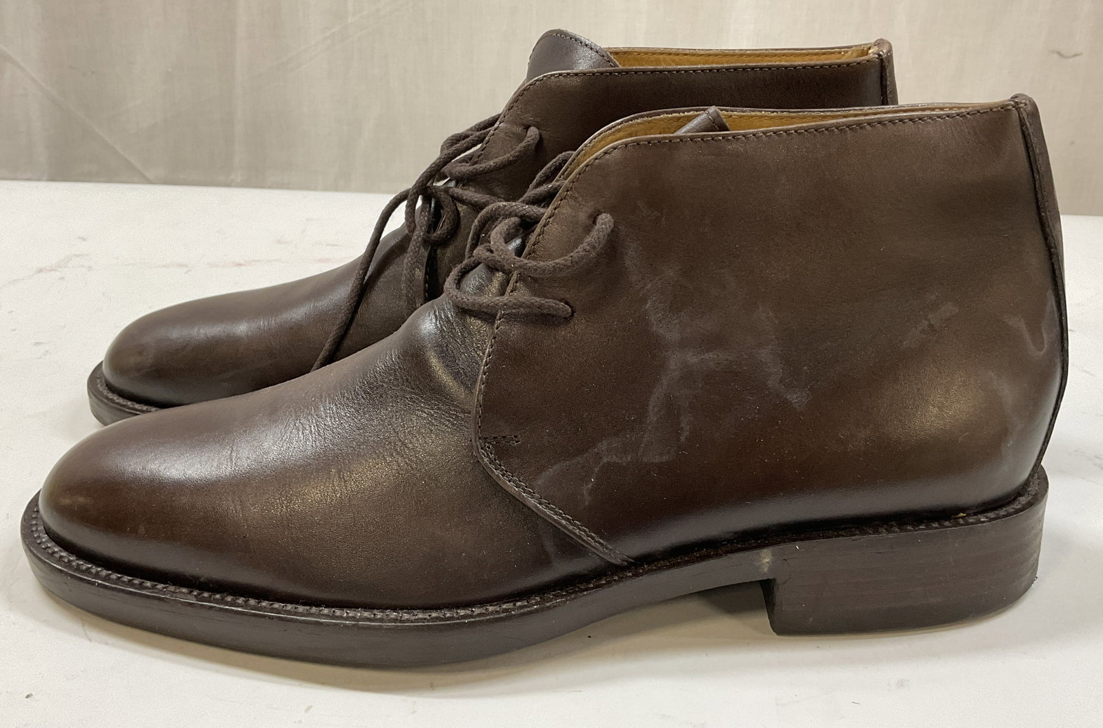 Vintage Brown Leather Lace Up Boots: Vintage brown leather lace up boots. No visible brand names. Size 42. Heeled shoe. Laces and stitching. Comes in storage box. Some scuffing and wear to leather. Boots, shoes, wearables, outerwear, fas