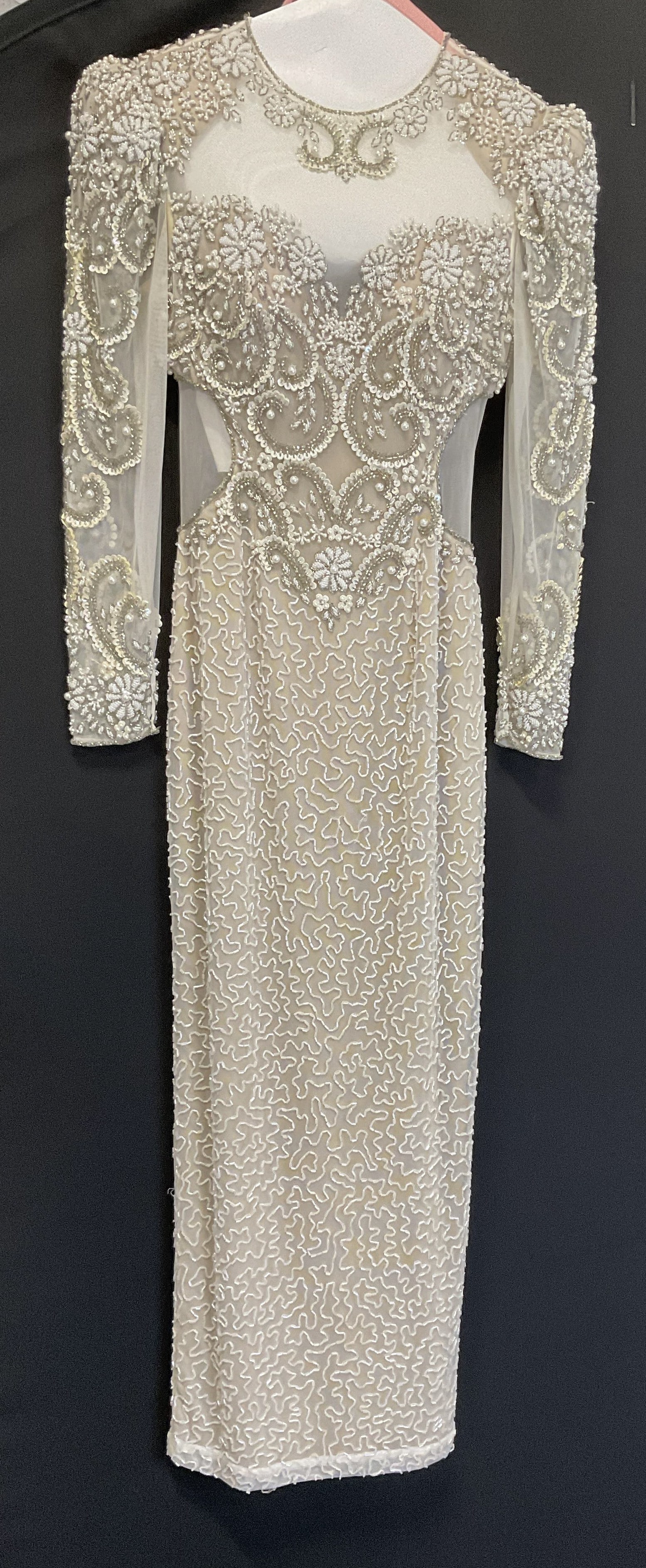 Beaded Vintage-Style White Formal Gown: Beaded Vintage-Style White Formal Gown. White Mesh Over A Beige Silk Liner. Intricate Floral Beadwork with Sequins, White Beads, and Metallic Clear Beads. No Visible Brand or Size. Measures app 14.5in