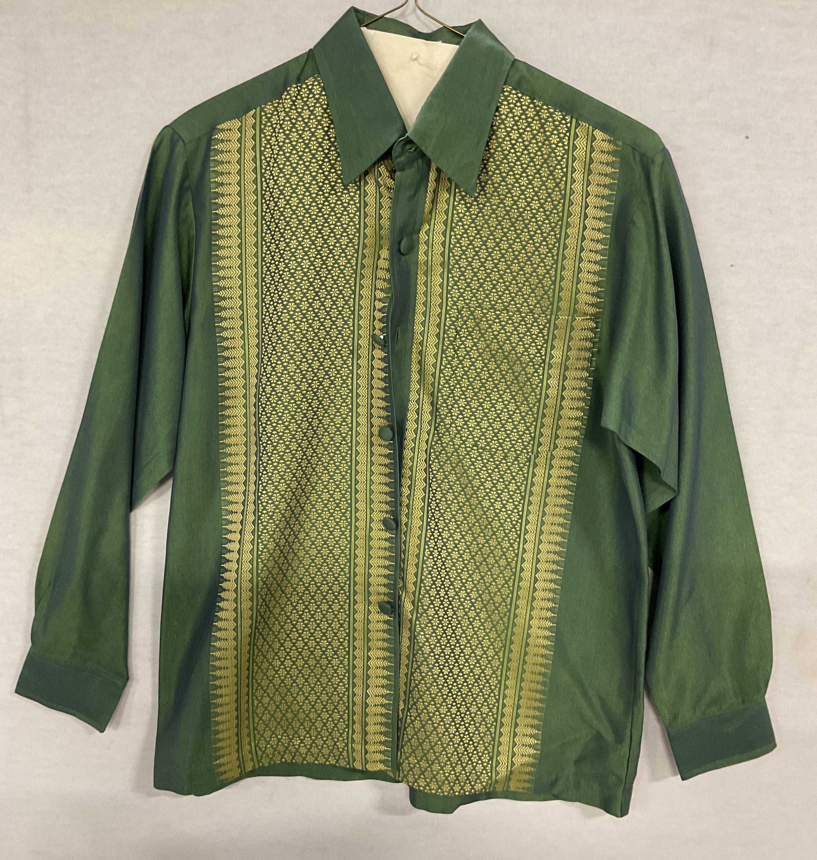 Oriental Thai Collect Green Silk Button Up Shirt: Oriental Thai Collection green silk patterned button up shirt. Size M. Made in Thailand. 100% Thai silk. Front pocket and collared. Some wear consistent with exposure. Oriental Thai Collection,