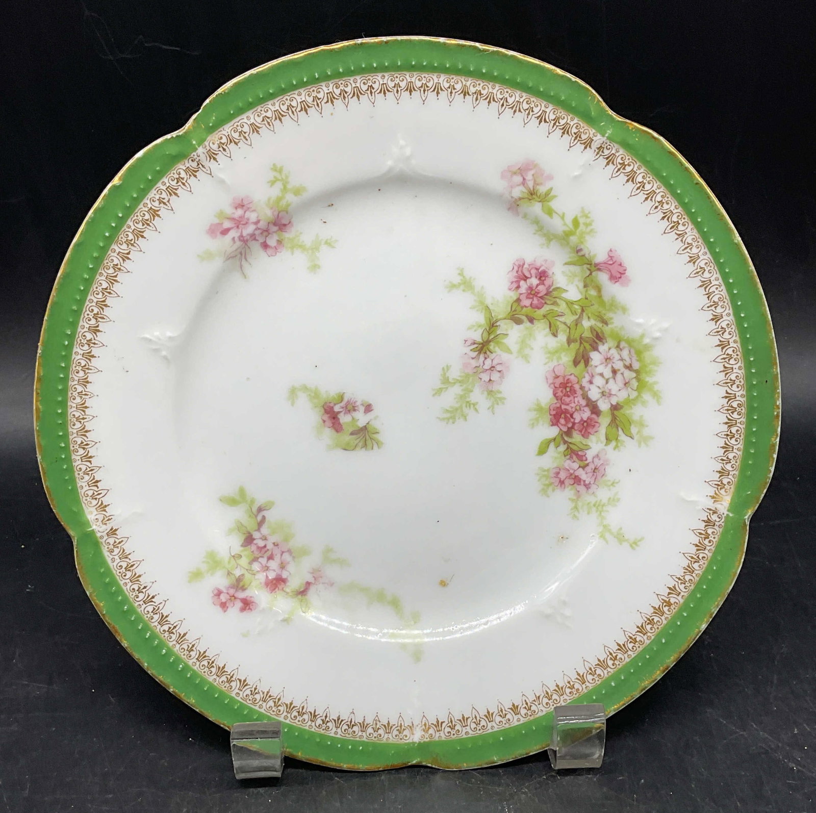 Antq LS&S Limoges Floral Porcelain Plate France: Antique L. S. & S. Lazarus Straus & Sons Limoges porcelain plate. Made in France. Green border with hand painted gilt and floral motif. Measures approx. 7.75 inches wide. Some scratching and loss to p