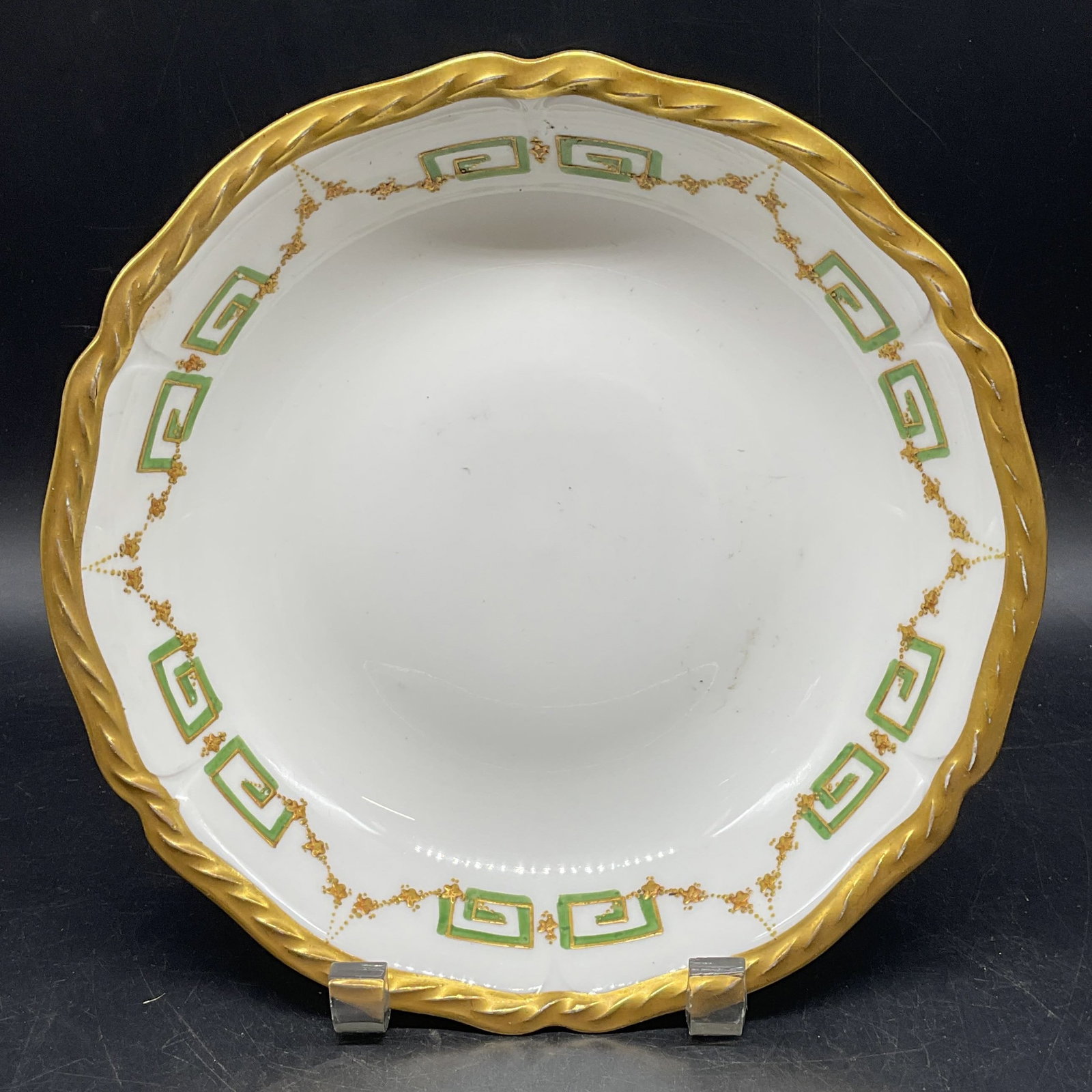 Antq B & H Limoges Gilt Porcelain Bowl France: Antique B & H Blakeman and Henderson Limoges porcelain serving bowl. Hand painted gilt and green garland and key motif. Made in France. Measures approx. 8.75 x 1.75 inches. Some scratching and loss to