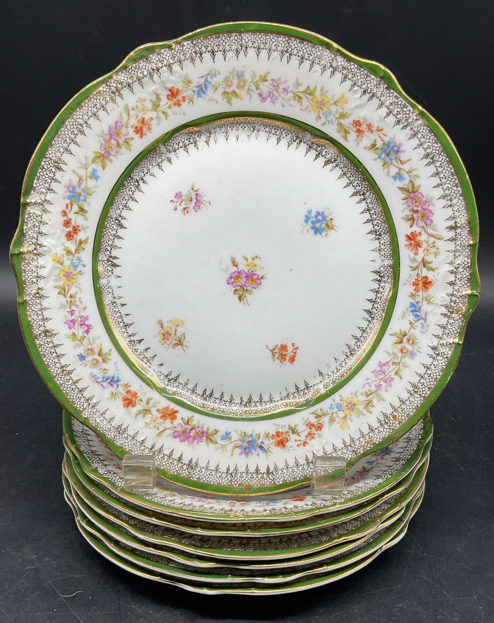 7 Antq CT Porcelain Tielsch Floral Plates Germany: Set of 7 antique CT Carl Tielsch porcelain plates. Made in Germany. Hand painted gilt green and floral motif. Measures approx. 7.5 inches wide. Some scratching and loss to paint. Antiques, collectible