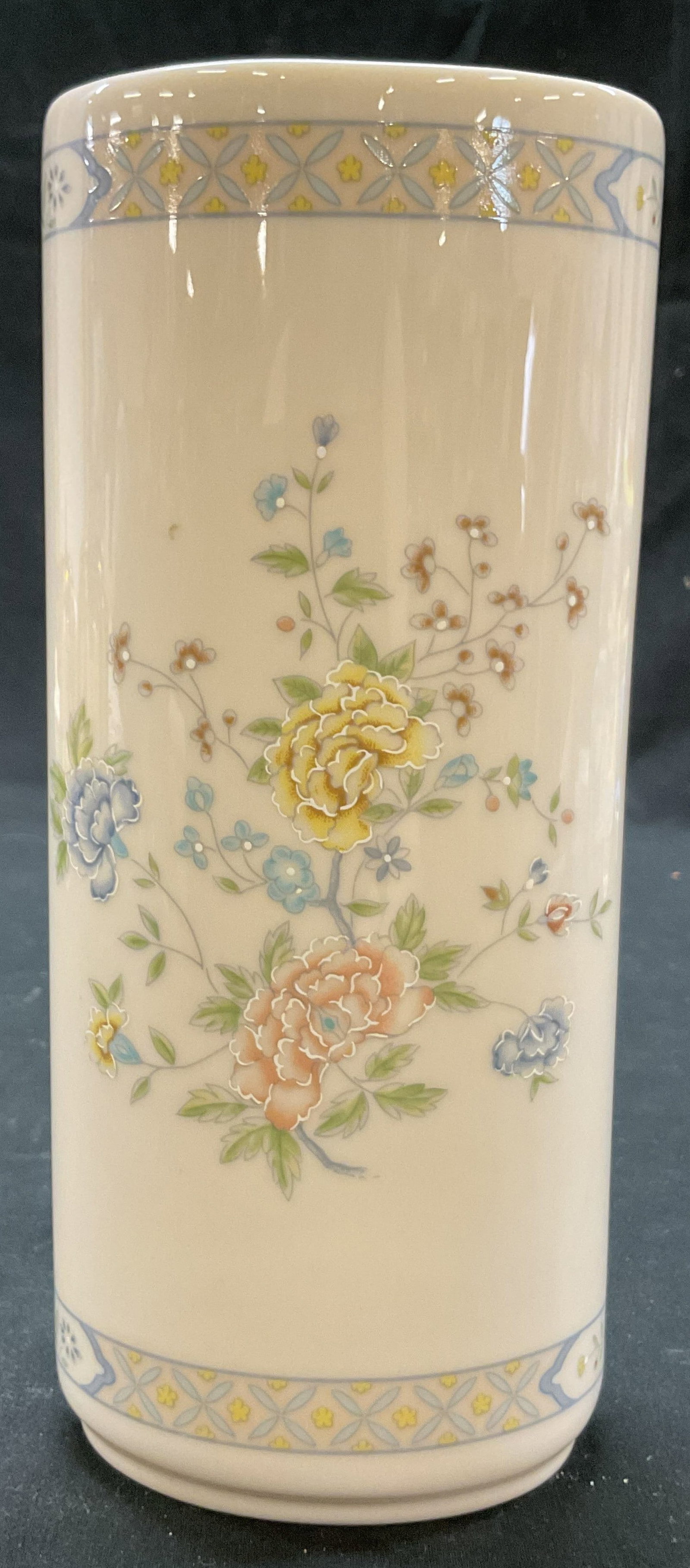 Gorham Fine China Cherrywood Vase USA: Gorham fine china cherrywood vase. Marked on underside, reads Gorham Fine China USA Designed And Produced Exclusively For The Danbury Mint. Tall cylindrical shape. Cherrywood patter, floral and geomet