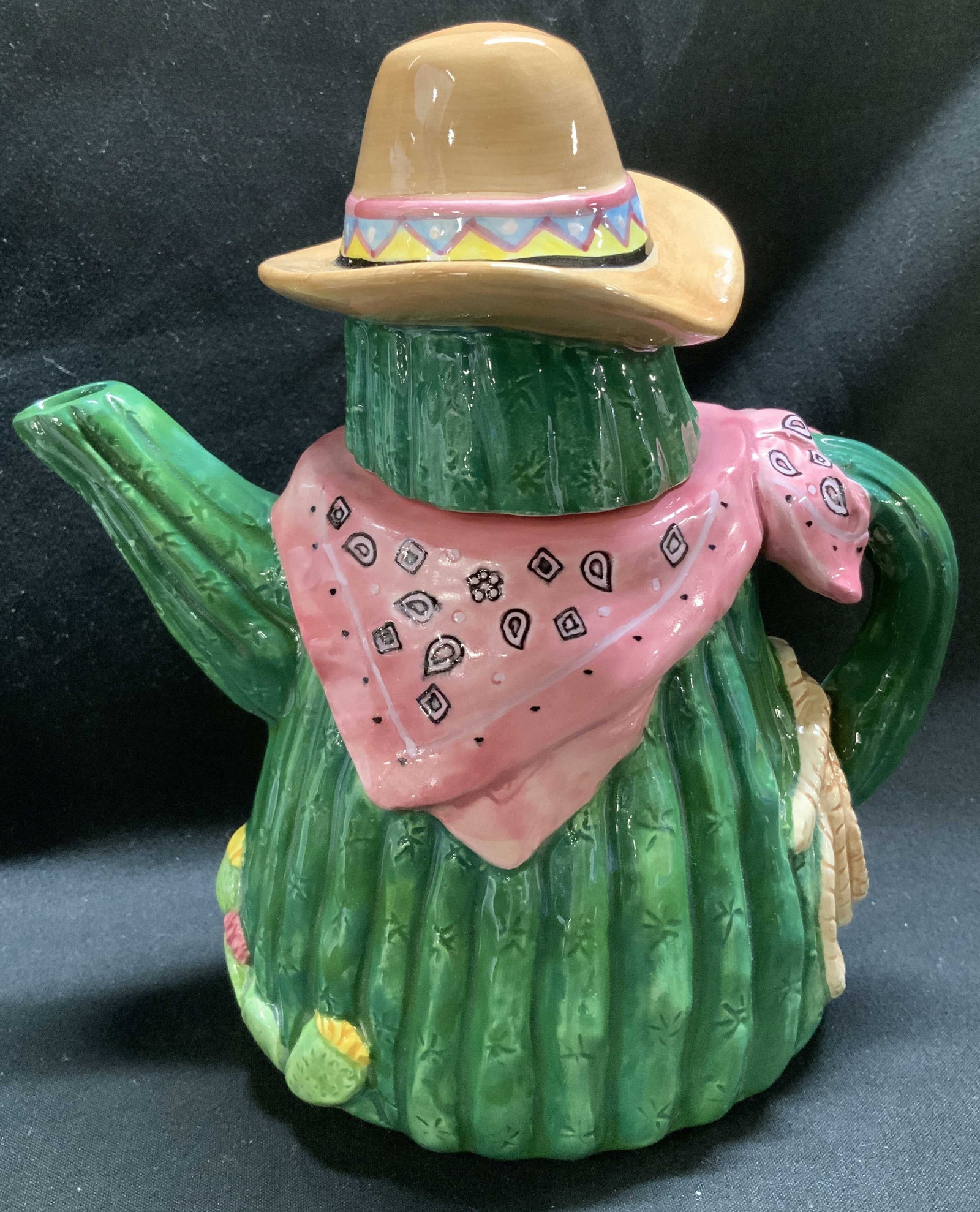 1995 Schmid Betsy Hazelton Musical Teapot: 1995 Schmid ceramic musical teapot designed by Betsy Hazelton. Teatime Harmonies. Teapot is shaped like a cactus wearing a cowboy hat & pink bandana. Signed & marked on underside. Reads, SCHMID 1995. 