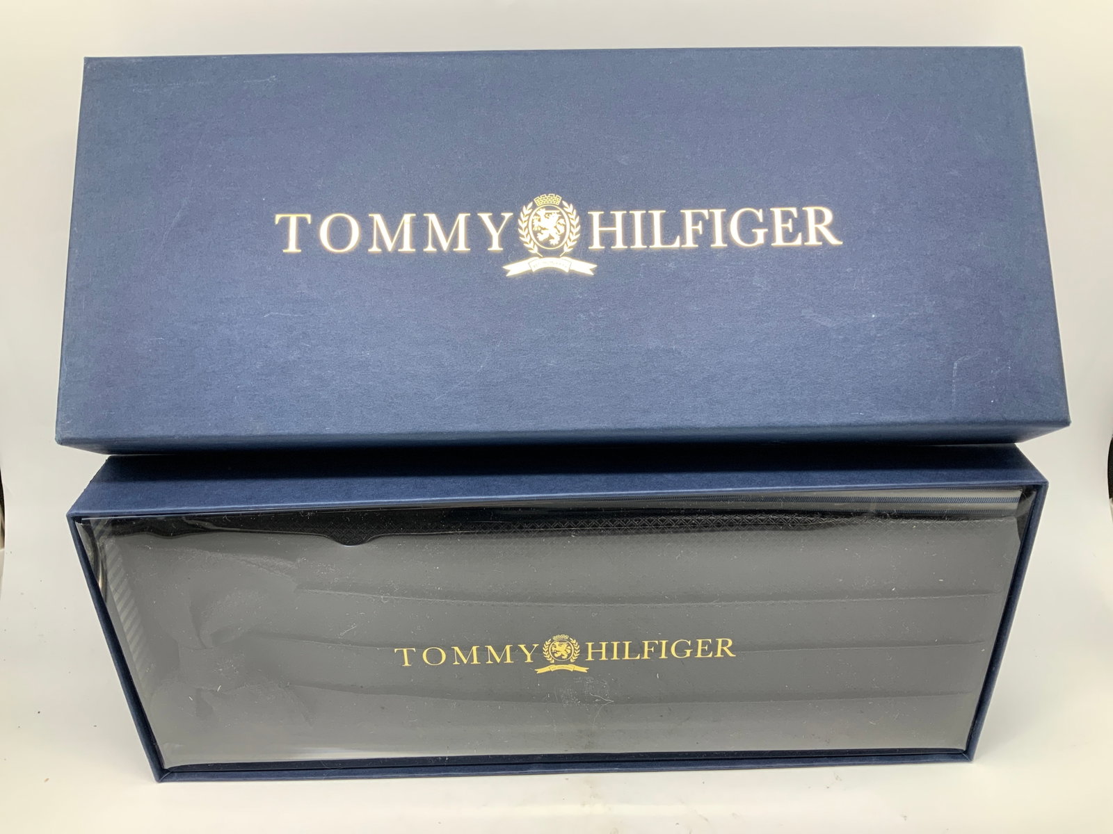 Tommy Hilfiger Cummerbund & Necktie W Box: Lot includes, Tommy Hilfiger cummerbund & necktie. Black toned. Feels like cotton. Comes with original box. Signed & marked. Reads, Tommy Hilfiger. Surface wear consistent to age, use & exposure. Meas