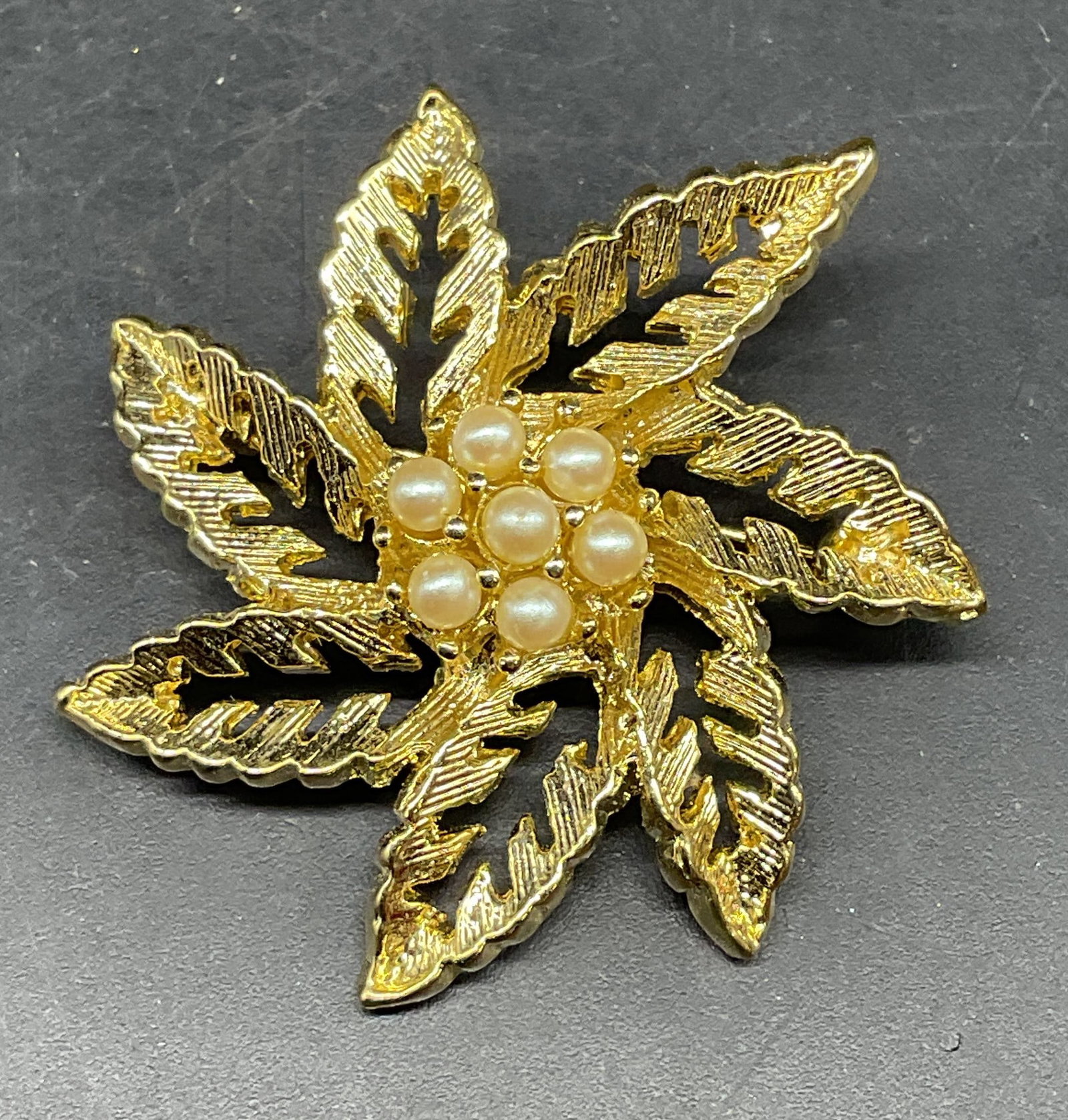 Vintage Gold Tone Faux Pearl Flower Brooch: Vintage gold tone and faux pearl flower brooch. Measures approx. 1.5 inches wide. Includes a box. Some scratching. Jewelry, estate jewelry, fine jewelry, cocktail jewelry, fashion jewelry, accessories