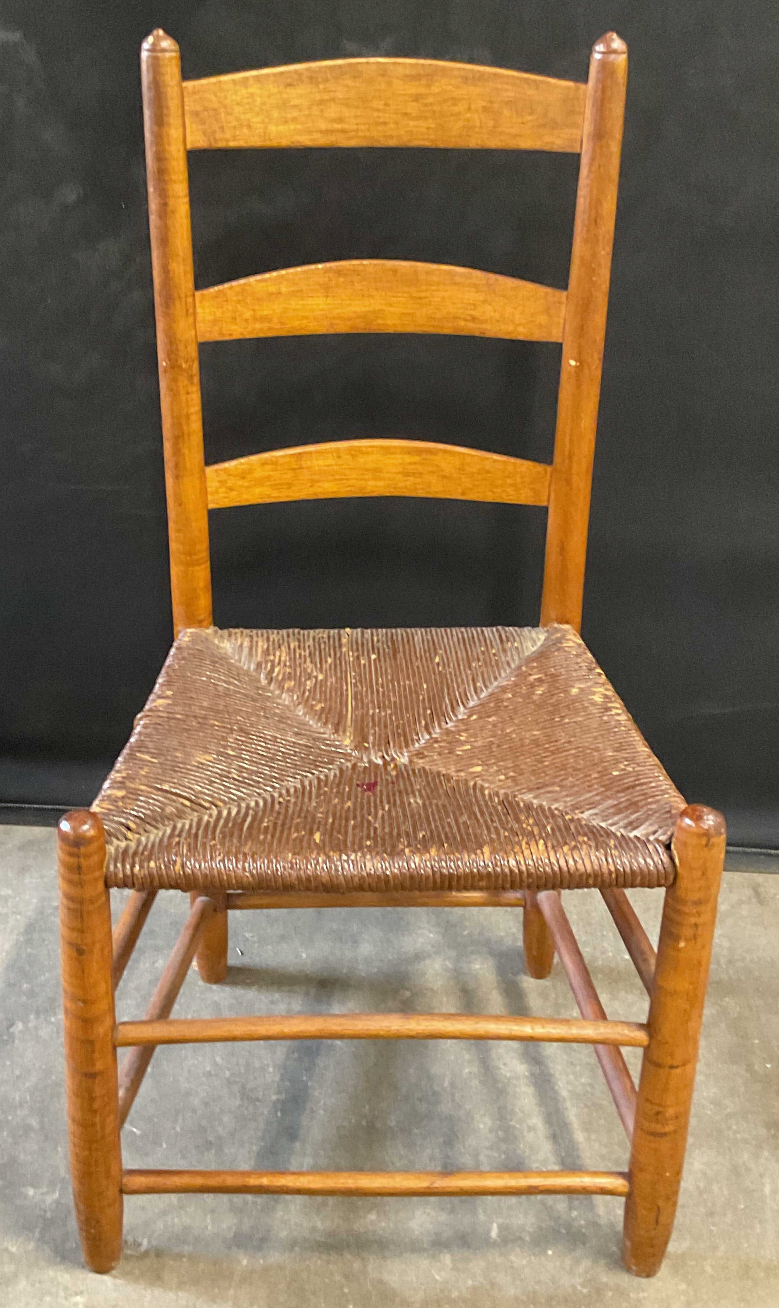 Vintage Ladder Back Rush Seat Chair: Vintage wooden chair with ladder back and rush seat. Measures approx. 14 x 18 x 34.5 inches. Wear including scratching and marks. Wood chair, ladder back chair, rush seat chair, furniture, Vintage fur