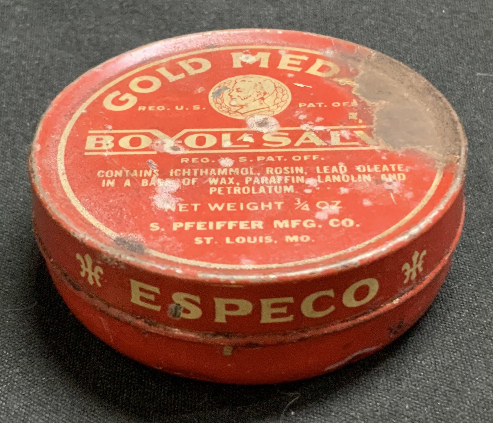 Vtg S.Pfeiffer Mgf. Co. Gold Medal Boyol Salve Tin: Vintage S. Pfeiffer Mfg. co. gold metal boyol salve medical ointment tin. Red toned. Round shape. Surface wear consistent to age, use & exposure. Lid is stuck, sold a is. Measurements: length 2.1in x 