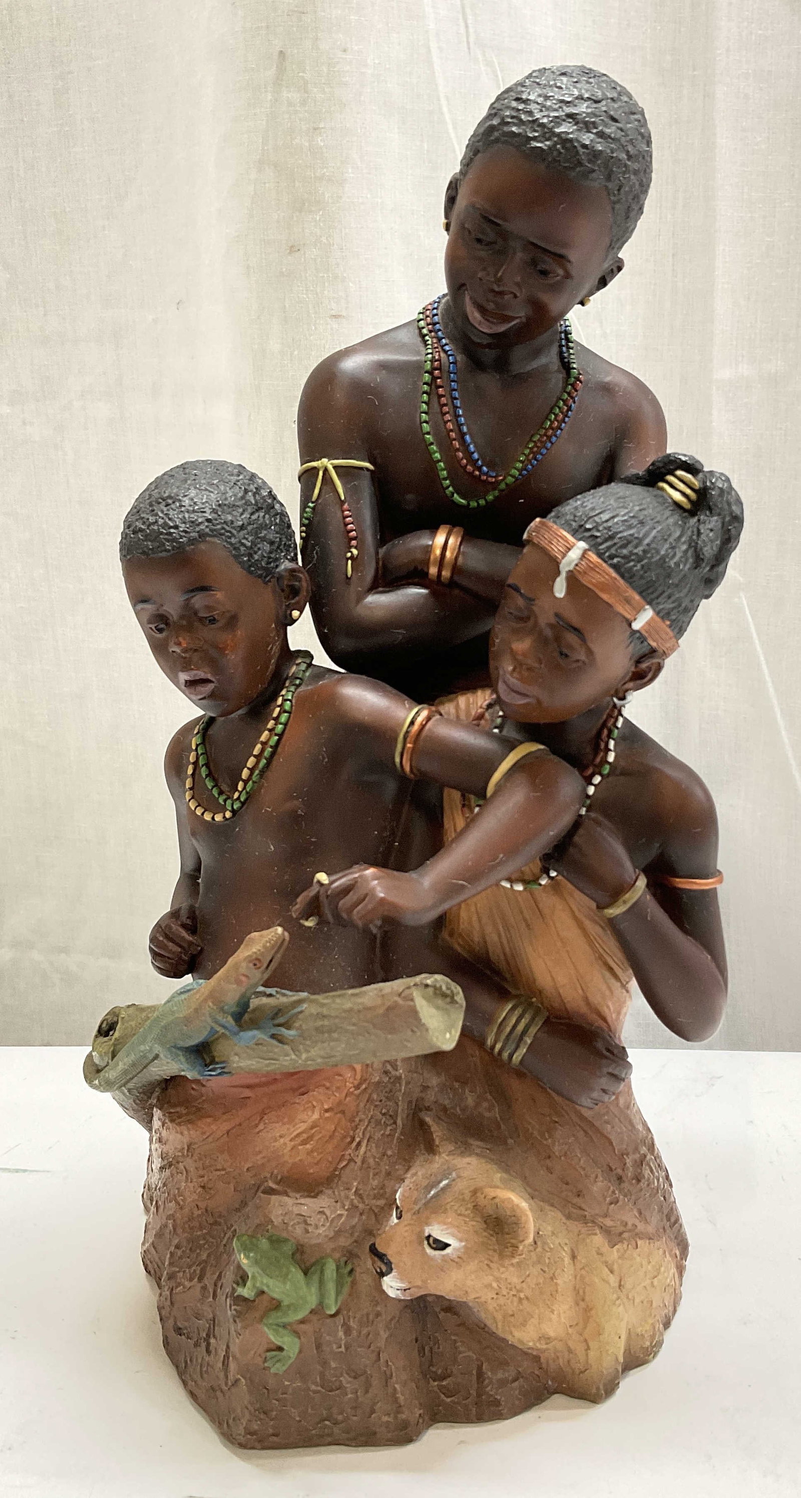 2004 SGND Dave Grossman Creations African Family: 2004 Signed T. Snyder Dave Grossman Creations Legacy Series African Maasai Family Statue. Depicts a father teaching his children to interact with nature. Hand-Painted Resin. Some scratching consistent