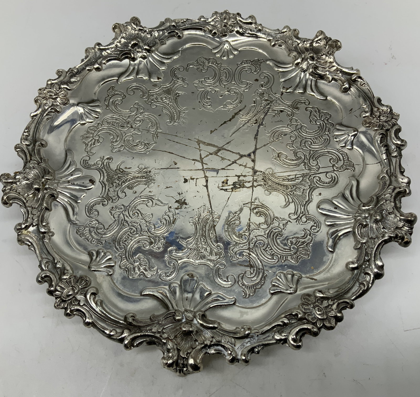 Vtg Corbell & Co. Silver Plated Salver: Vintage Corbell & Co. silver plated salver features intricate scroll detailing. Raised on 3 decorative feet. Signed & marked on underside. Visible stamped marking. Surface wear consistent to age, use 