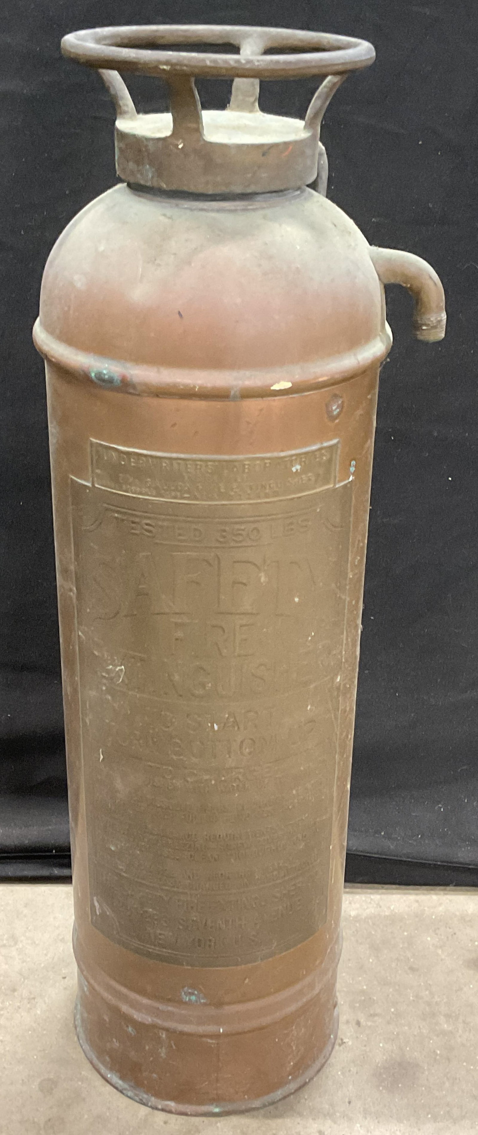 Antique Copper Safety Fire Extinguisher: Antique copper fire extinguisher manufactured by The Safety Fire Extinguisher Company, New York. Copper with brass plaque. 2 1/5 gallon canister. Measures approx 7 x 24.25 inches lower including patin