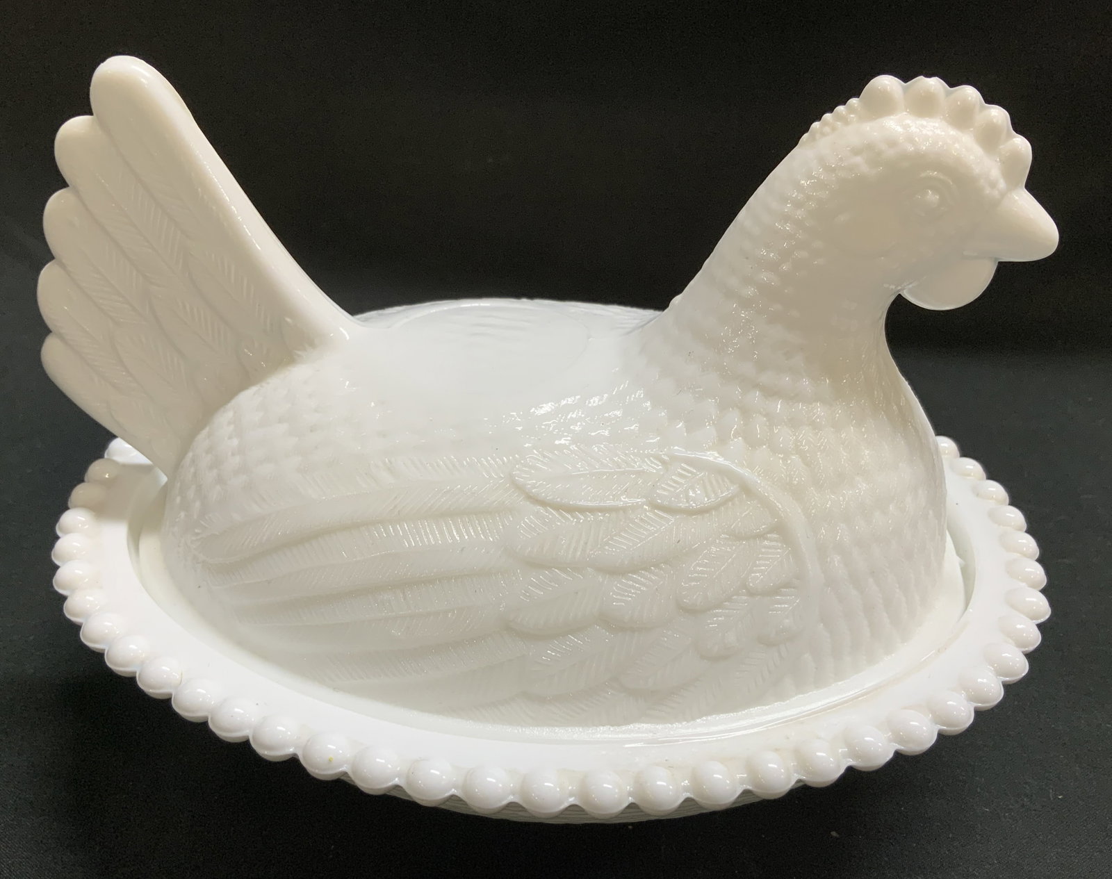 Vntg Milk Glass Chicken Lidded Vessel: Vintage milk glass lidded vessel depicts a hen sitting on a nest. Beaded rim & intricate detailing on hen. No visible signature or markings. Surface wear consistent to age, use & exposure. Measurement