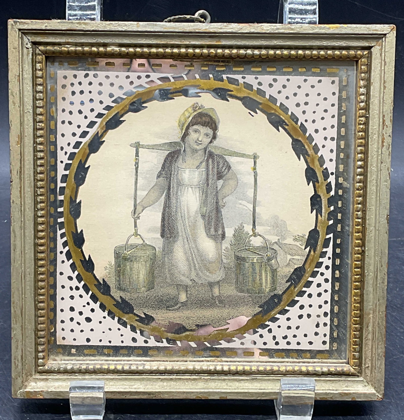 Antique Hand Colored Engraving Girl w Water: Framed antique hand colored engraving. Painted metallic mat/border. Girl with buckets of water. Gilt wood frame. Not examined out of frame. Frame measures approx. 5.75 x 5.75 inches. Wear including fo