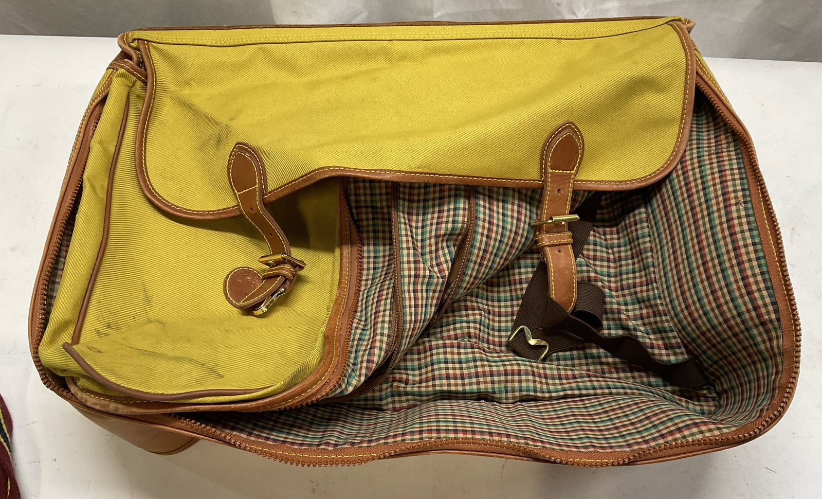VTG Ava Fashion Travel Leisure Canvas&Leather Bag: Vintage Ava Fashion Travel Leisure Yellow Canvas & Light Brown Leather Messenger Bag. Outside Crest Reads Buon Viaggio (Italian for Have a Good Trip). Red, Green, and Brown Plaid Lining. Comes with Co