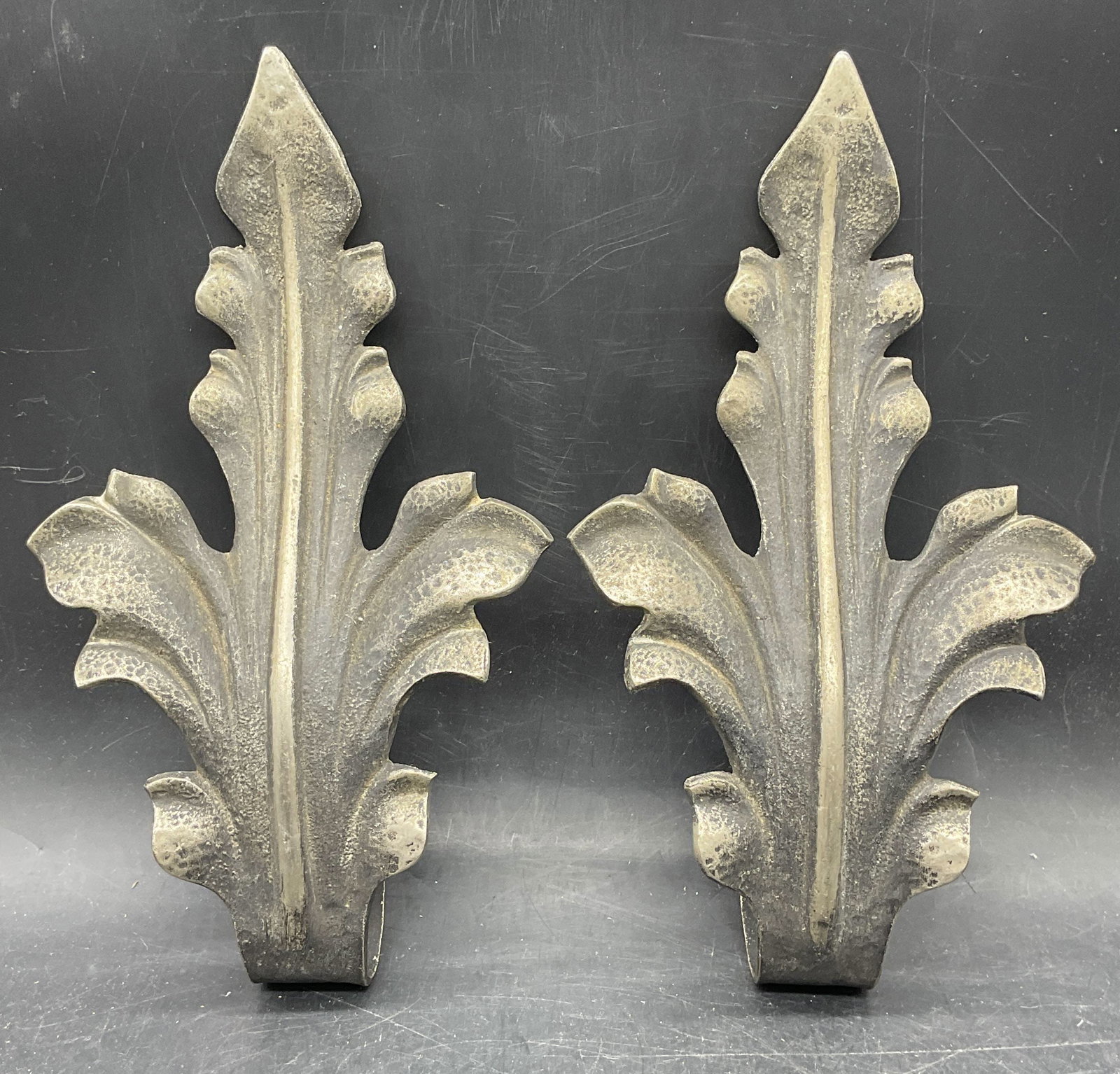 Pair Vtg Silver Tn Acanthus Leaf Curtain Tie Backs: Pair of vintage silver tone metal acanthus leaf curtain tie backs. Measures approx. 9.5 x 5.25 inches. Wear including patina and scratching. Curtain tie back, acanthus leaf tie back, silver tone tie b