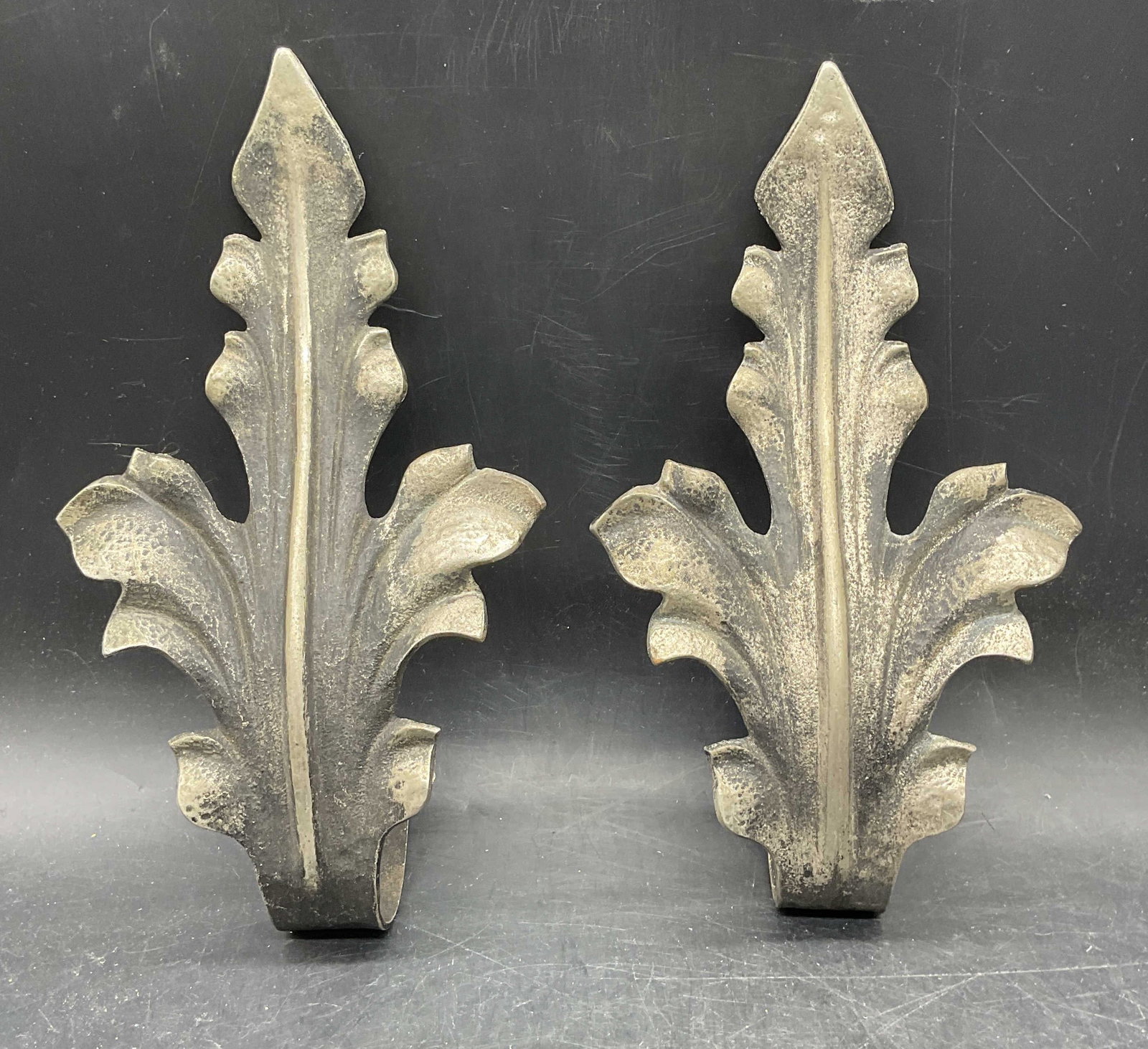 Pair Vtg Silver Tn Acanthus Leaf Curtain Tie Backs: Pair of vintage silver tone metal acanthus leaf curtain tie backs. Measures approx. 9.5 x 5.25 inches. Wear including patina and scratching. Curtain tie back, acanthus leaf tie back, silver tone tie b