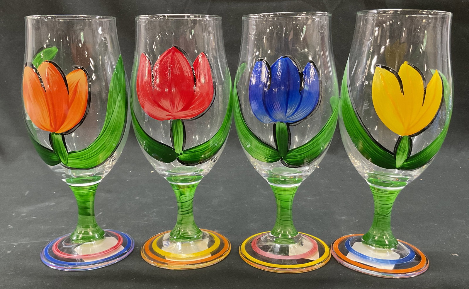 Set 4 I. Godinger Hand Painted Wine Glasses Italy: Set of 4 I. Godinger hand painted glass wine glasses. Marked I. Godinger Made In Italy. Round base and bulbous body. Hand painted floral motifs in green, red, orange, blue, and yellow. Painted green s