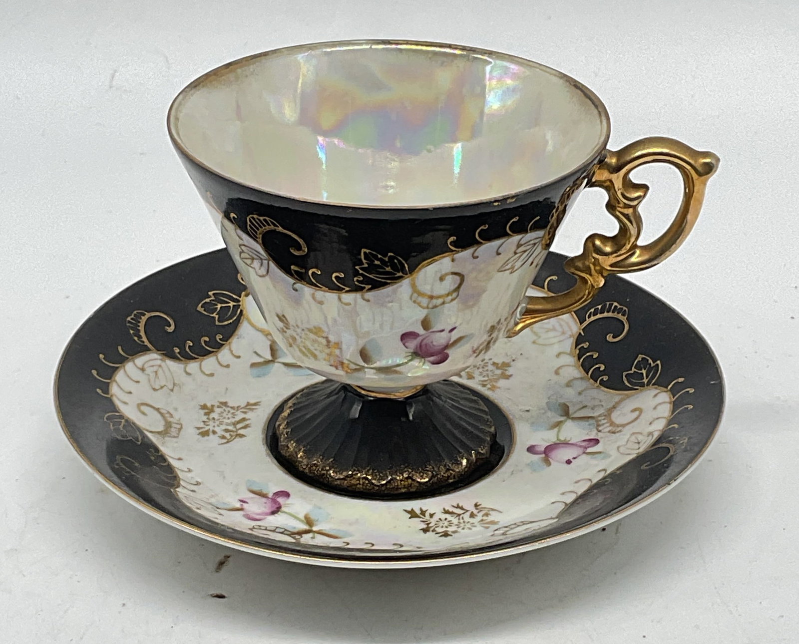 Royal Sealy China Black Floral Teacup & Saucer: Vintage Royal Sealy China teacup and saucer. Hand painted Black with gilt decoration and floral motif. Made in Japan. Saucer measures approx. 5.75 inches wide. Cup measures approx. 3.5 x 3 inches.
