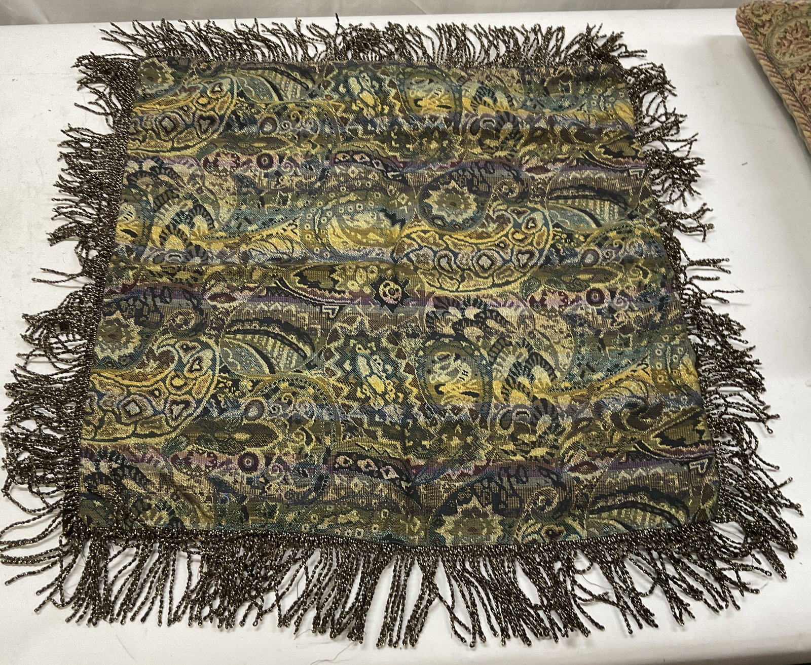 VTG Paisley Jacquard-Woven Throw Pillow Cover: Vintage Colorful Jewel Toned Paisley & Floral Pattern Jacquard-Woven Throw Pillow Cover. Brown and Gilt Fringe. Velvet Backing. Condition Consistent with Exposure. Measures app 21in L x 21in W. Vintag