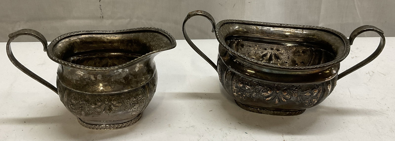 Lt 2 Sheffield Slvr-Pltd Creamer & Sugar ENGLAND: 2 Sheffield Silver-Plated Creamer & Sugar. England. Bottom Reads: Electroplated on Copper. A1 Quality. Made in Sheffield England. Scratching and Tarnishing Present. Measures app 4in H x 5in Diam. Shef