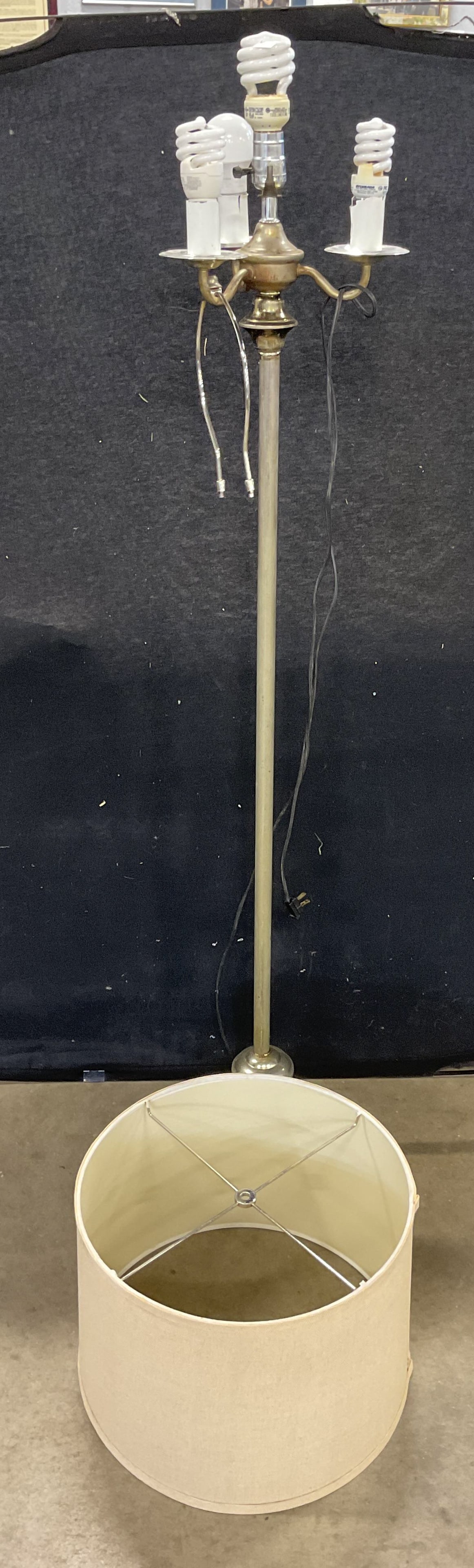 Silver Tone Candelabra Style Floor Lamp: Silver tone metal candelabra style floor lamp with beige fabric shade. Measures approx. 9 x 54 inches. Not tested. Some wear including scratching, patina, and some losses. Floor lamp, metal, lamp, sil