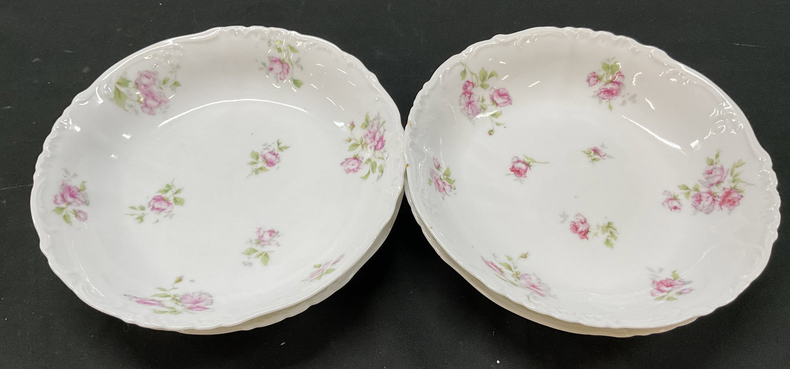 Set 4 Imperial Carlsbad Porcelain Bowls Austria: Set of 4 Imperial Carlsbad porcelain bowls. Marked on underside, reads Imperial H & C Carlsbad Austria. Scalloped edge. Floral motifs in pink and green. Measures ht approx 1.5 inches diam approx 7.5 i