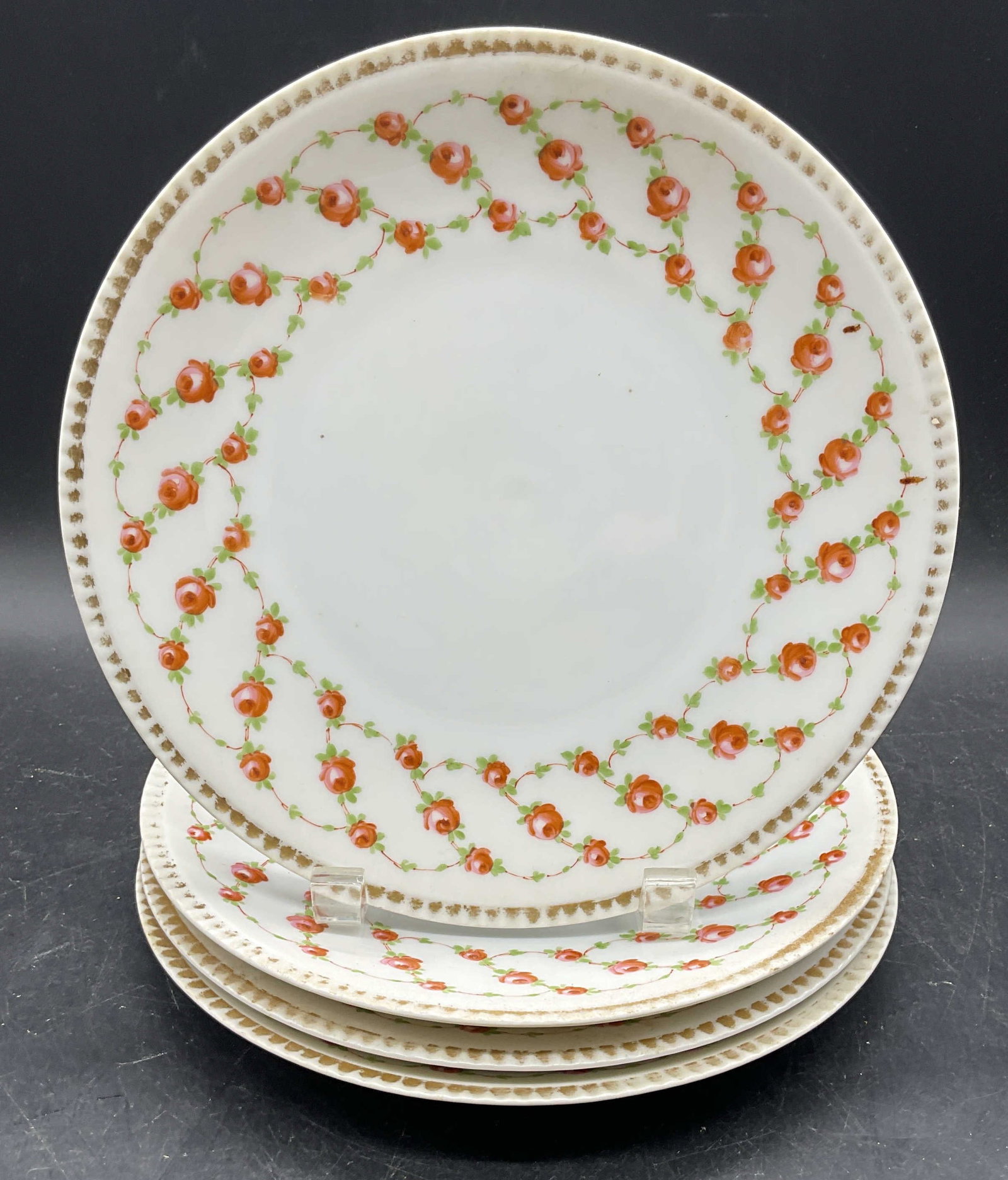 4 Heinrich & Co Porcelain Floral Plates Germany: Set of 4 vintage Heinrich & Co H & Co Bavaria porcelain plates. Made in Germany. Hand painted gilt and floral motifs. Measures approx. 8.5 inches wide. Some scratching and loss to paint. Heinrich and 