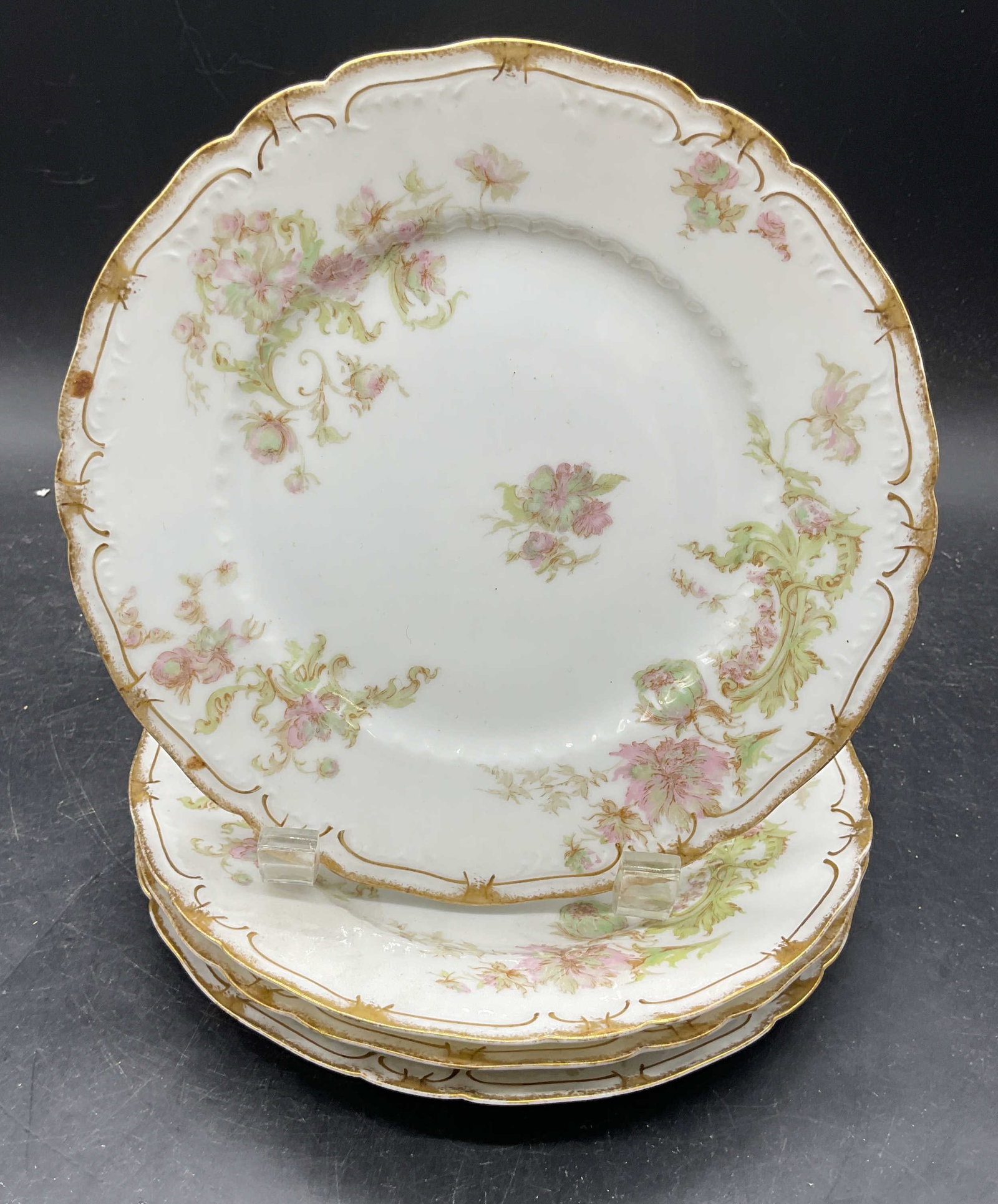 4 Antq HAVILAND Limoges PDG Porc Plates France: Set of 4 antique HAVILAND Limoges porcelain plates for PDG Co. made in France. Hand painted and gilt floral motifs. Measures approx. 7.5 inches wide. Wear including scratching and loss to paint. Antiq
