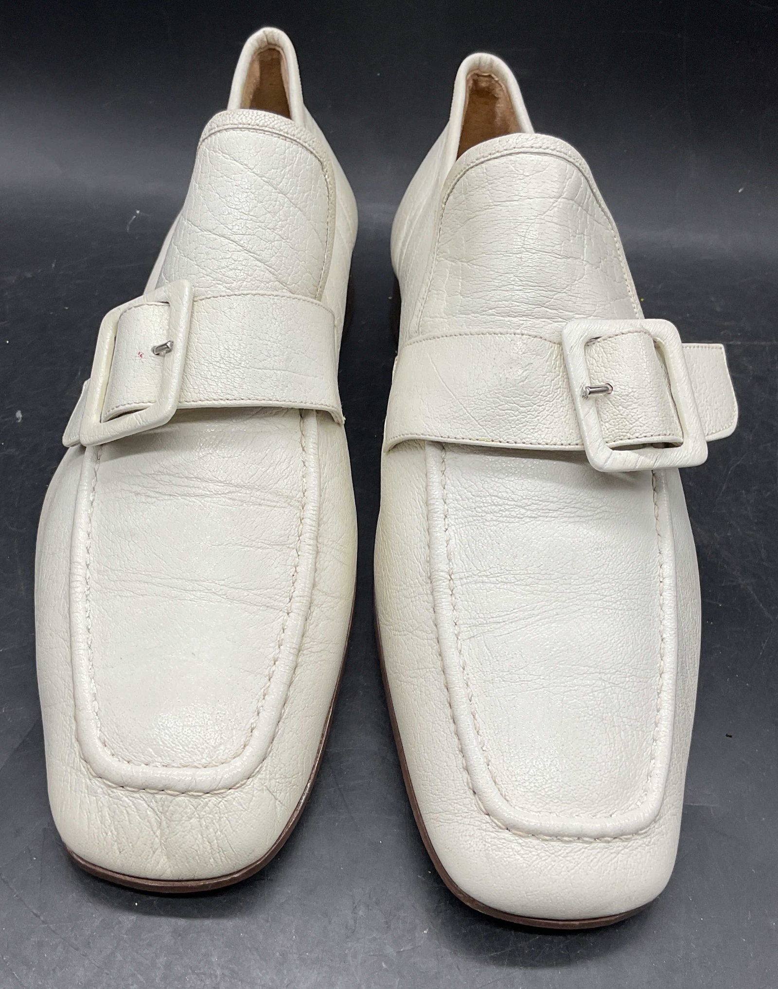 De Lilo White Leather Loafers, Italy: De Lilo white leather loafers with buckle. Made in Italy. Size 10. Wear including scuffing, scratching, creasing. De Lilo shoes, designer shoes, white shoes, leather shoes, leather loafers, wearables,