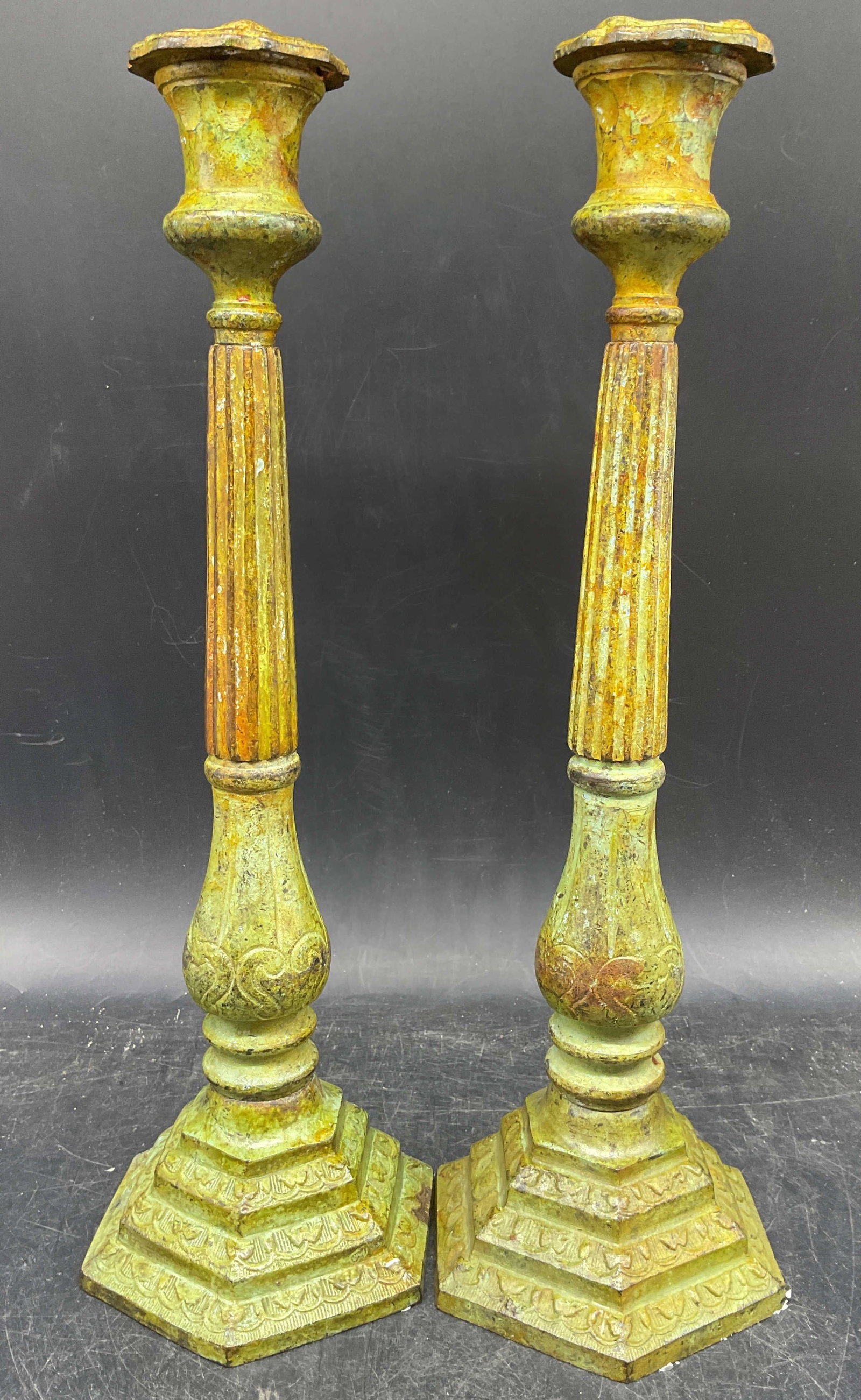 Vtg Pair Verdigris Patina Metal Candlesticks: Vintage pair of cast metal candlesticks with verdigris patin. Ornate column shapes. Measures approx. 4.5 x 4 x 13.5 inches. Wear including scratching and wax residue. Verdigris candlesticks, column ca