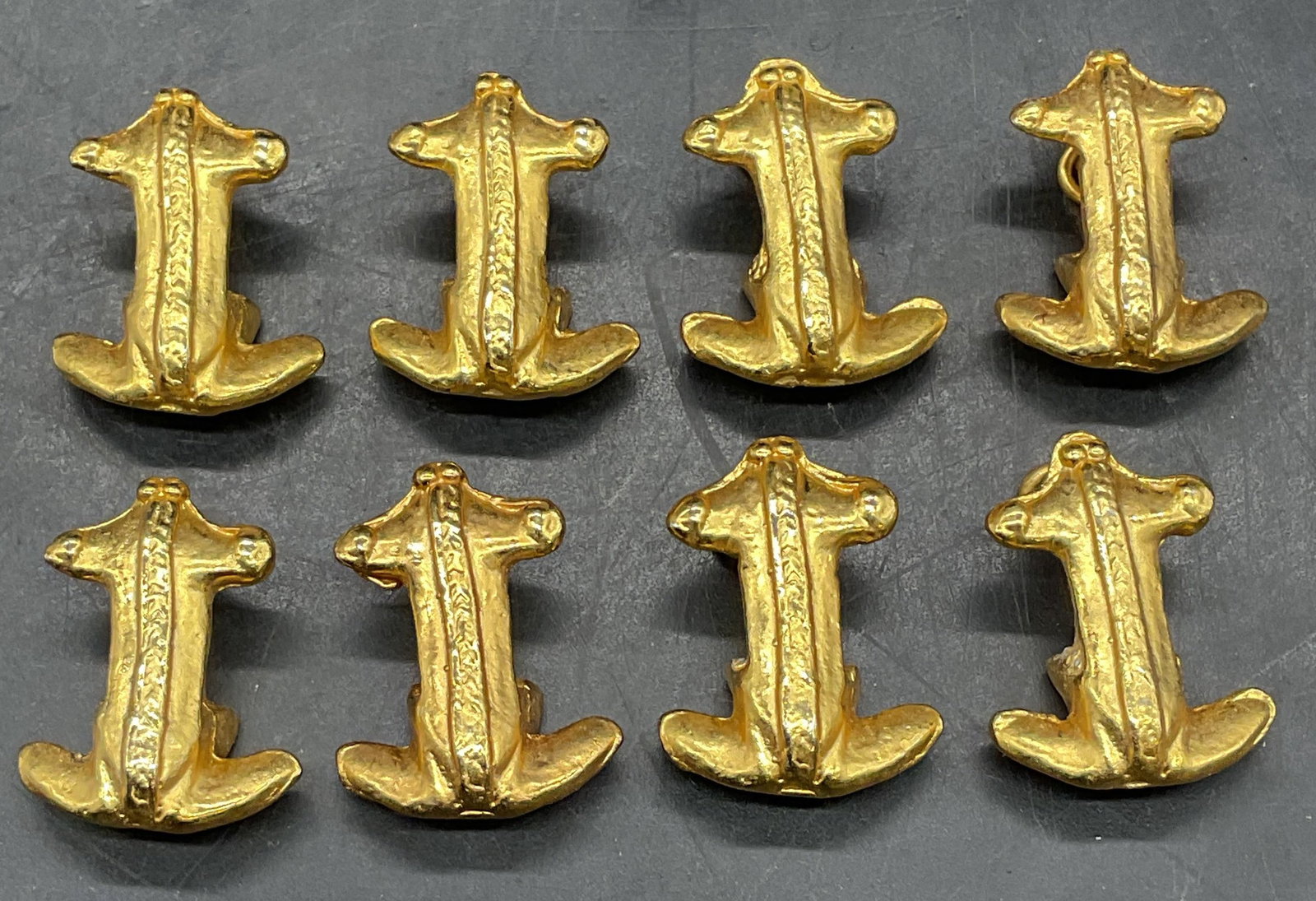 Set 8 Gold Tone Anchor Pendants: Set of 8 gold tone anchor motif pendants. Measures approx. 1 x .75 inches. Some scratching. Jewelry, estate jewelry, costume jewelry, cocktail jewelry, fashion jewelry, accessories, fashion accessorie