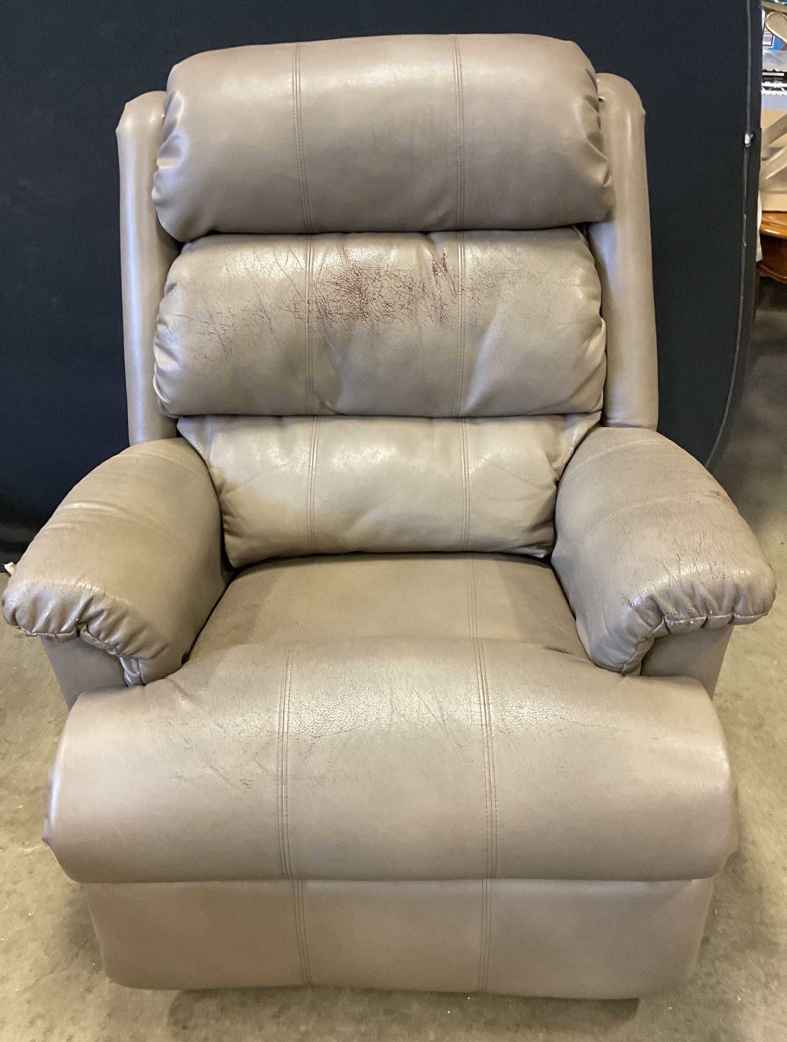 La Z Boy Grey Leather Rocking Recliner Chair: La Z Boy grey leather rocking and reclining armchair. Measures approx. 35 x 34 x 44 inches. Wear including loss to leather, scratching. La z boy armchair, leather armchair, leather rocking chair, leat
