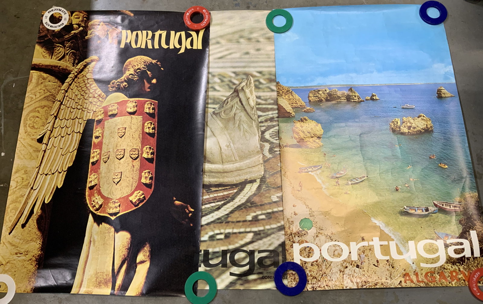 Lot 3 Assorted Portugal Tourism Posters: Lot includes, 3 Portugal posters depicting a scenic aerial view of a beach, angel figure & foot. Posters read, Algarve & Conimbriga. Signed & marked. Reads, CREATED & ISSUED BY PORTUGUESE NATIONAL