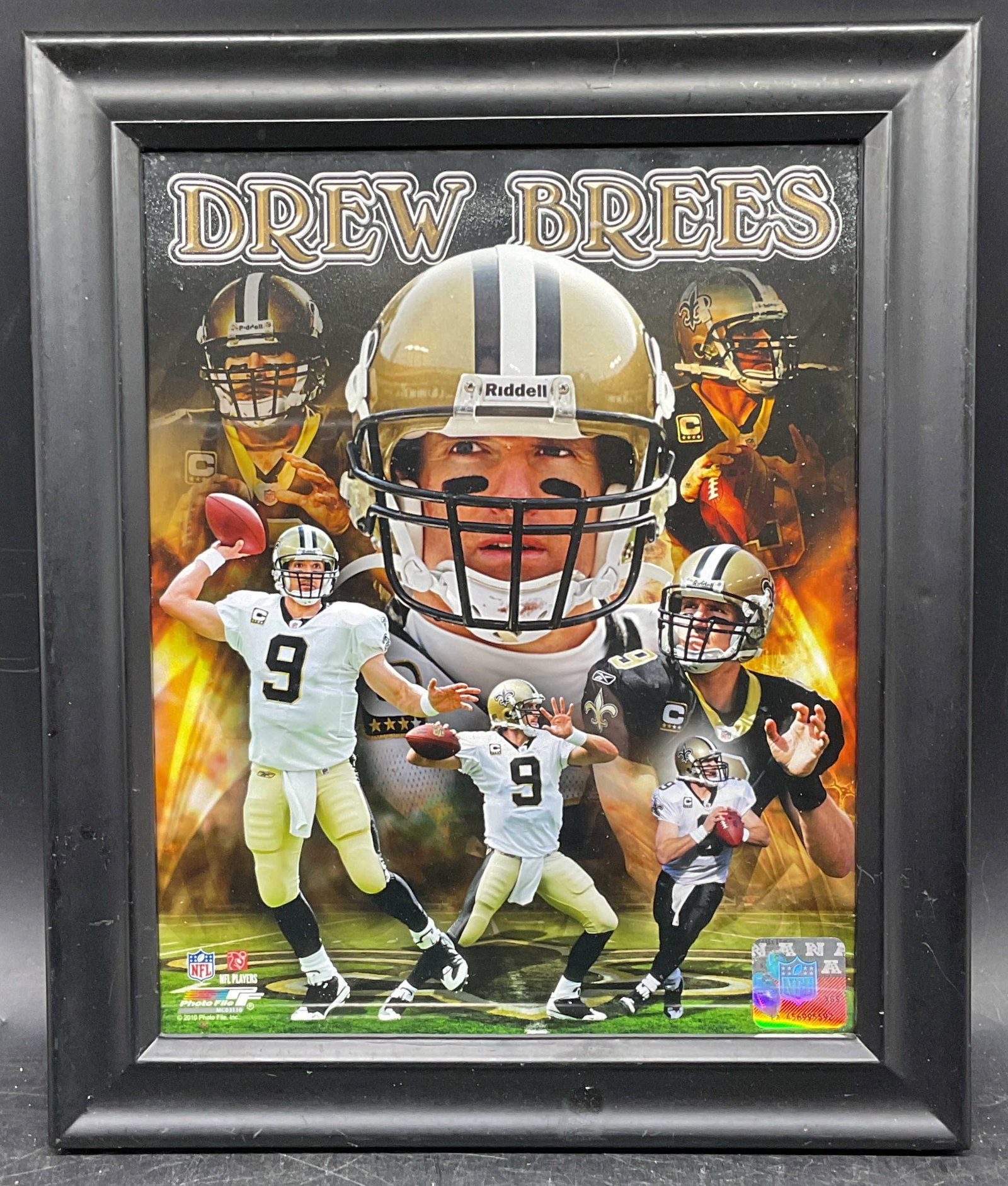 Official NFL Drew Brees Saints Portrait Litho: Framed official NFL commemorative portrait lithograph of Drew Brees. New Orleans Saints quarterback. Black wood frame. Not examined out of frame. Frame measures approx. 12 x 10 inches. Some wear