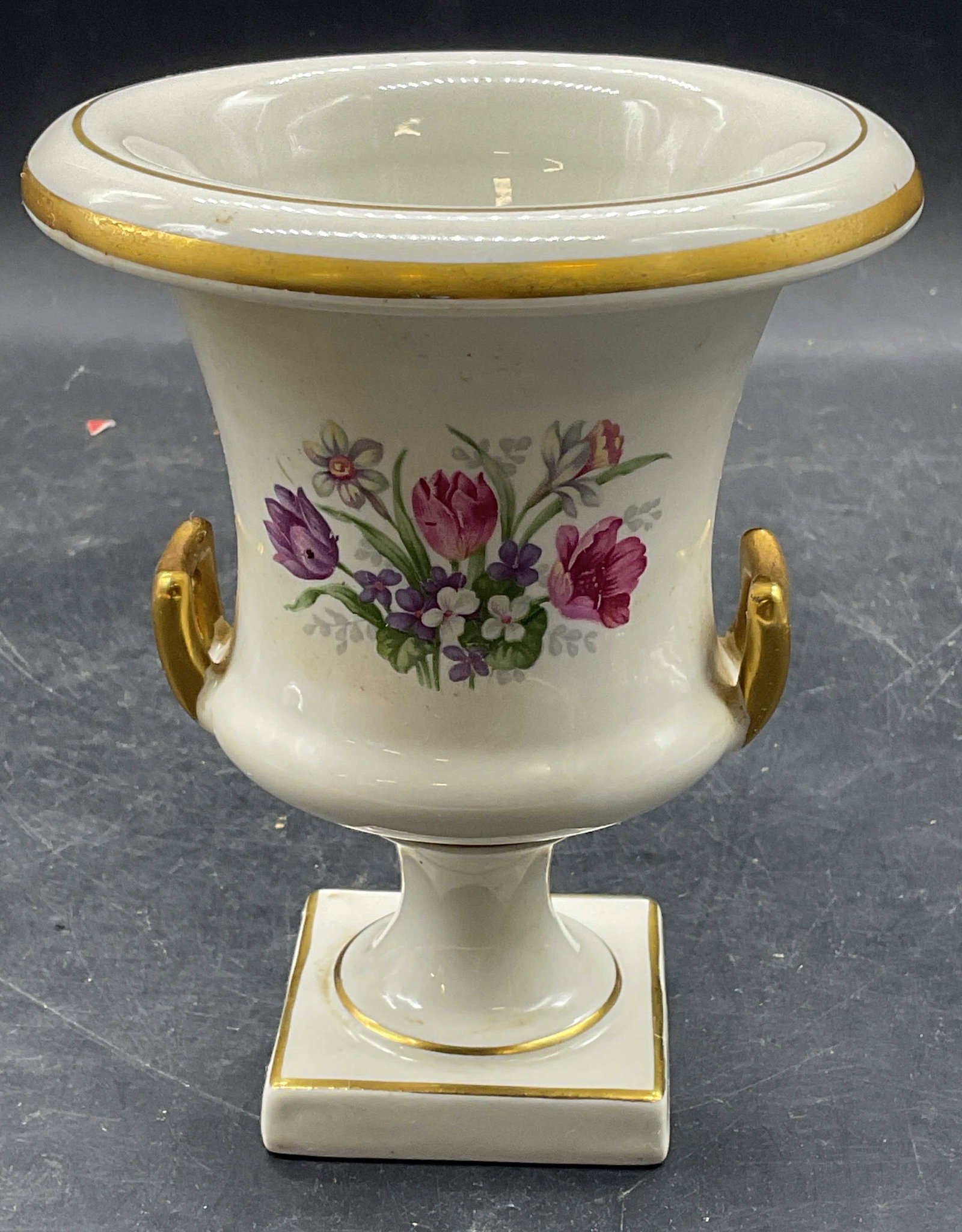 Vintage Trenton Pottery Ceramic Floral Urn Vase: Vintage Trenton Pottery ceramic pedestal urn vase. Hand painted and gilt floral motif. Made in USA. Measures approx. 4.75 x 6 inches. Some scratching. Trenton pottery vase, Trenton pottery urn, urn va
