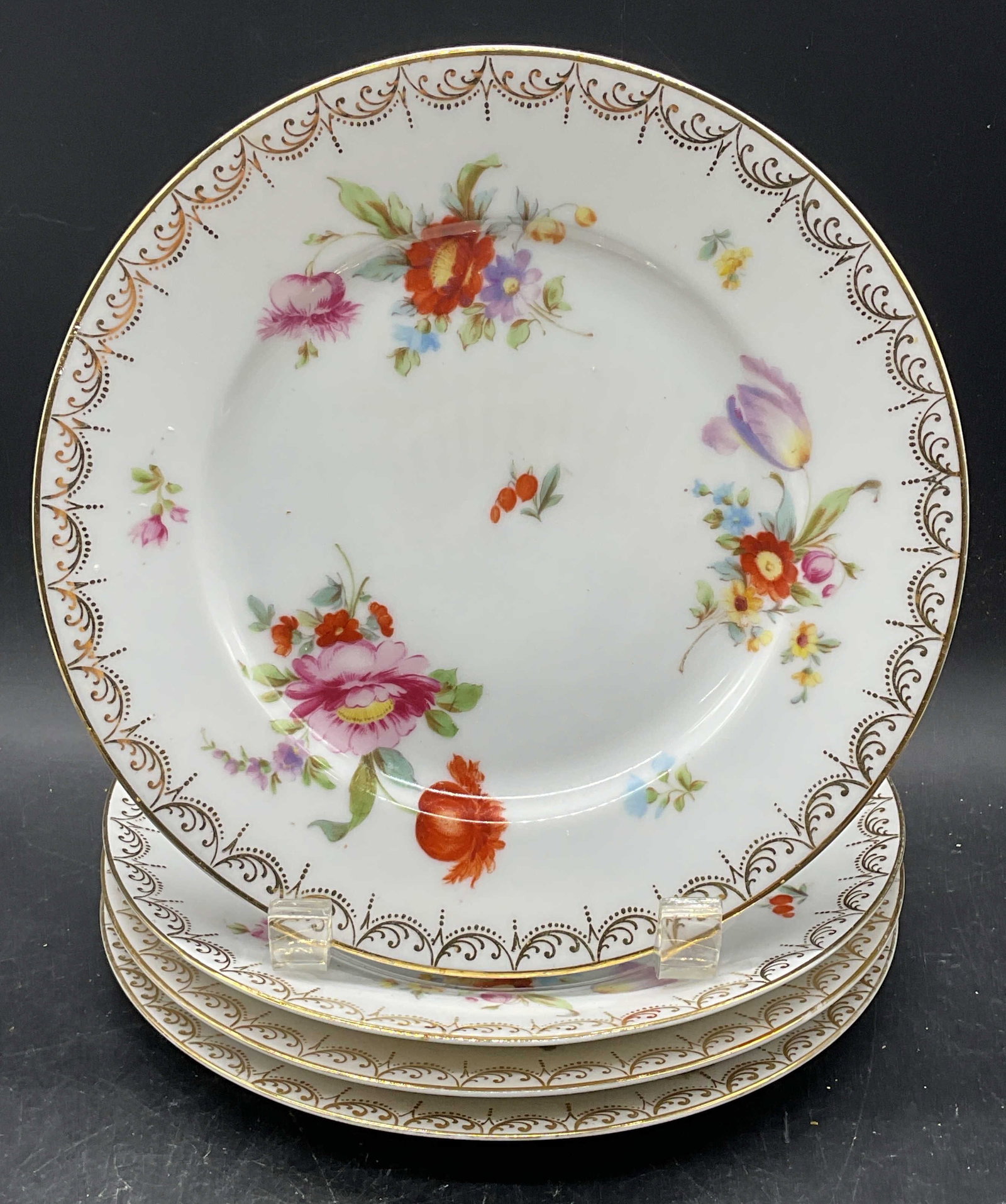 4 Tirschenreuth Old Messiaen Porc Plates Germany: Set of 4 vintage PT Tirschenreuth Bavaria porcelain plates. Made in Germany. Old Meissen pattern. Hand painted and gilt floral motifs. Measures approx. 7.75 inches wide. Some scratching and loss to pa