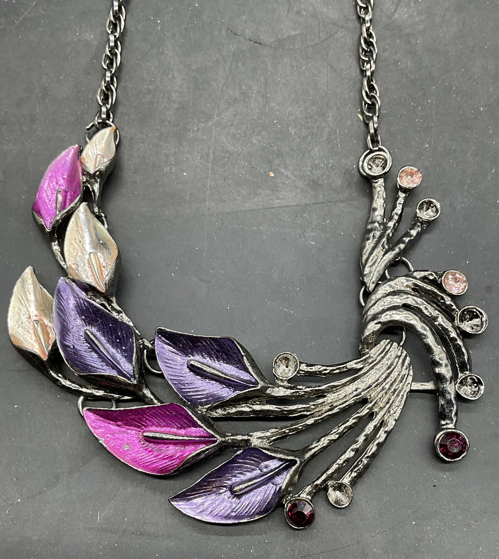 Silver Tone Floral Enamel Pendant Necklace: Silver tone floral pendant necklace with enameled and crystal decoration. Drop length measures approx. 9 inches. Some crystals need replacement. Some scratching. Jewelry, estate jewelry, costume jewel