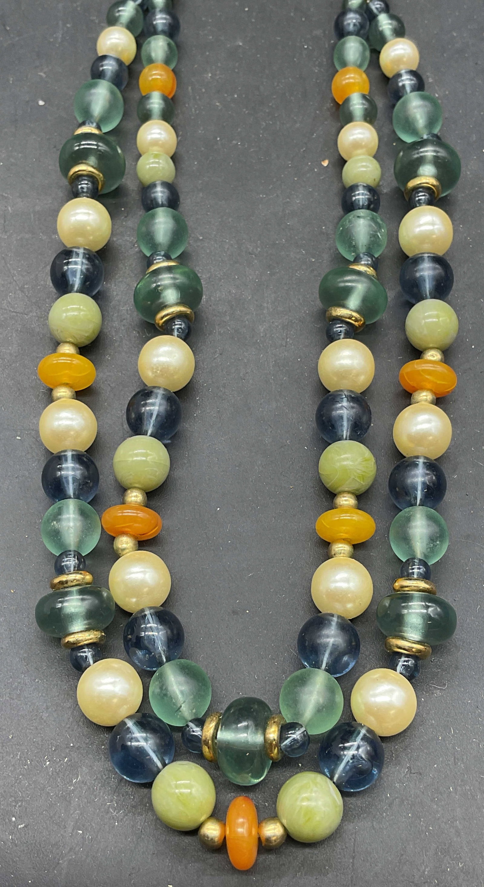 Lei Blue Faux Pearl Lucite Beaded Necklace: Signed Lei faux pearl and blue and amber toned lucite beaded necklace with gold tone accents. Drop length measures approx. 8.5 inches. Some scratching. Jewelry, estate jewelry, costume jewelry, cockta