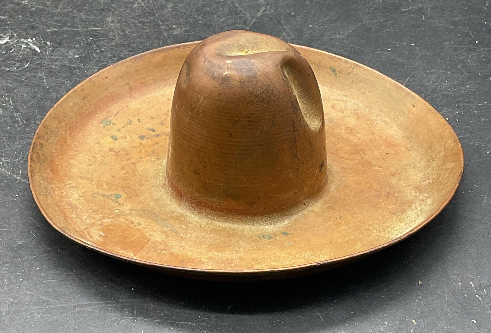 Vintage Copper Cowboy Hat Figurine: Vintage copper cowboy hat motif figurine. Measures approx. 5.25 x 2 inches. Scratching, patina and warping. Cowboy hat figurine, copper cowboy hat, home decor, home accessories, table decor, table acc