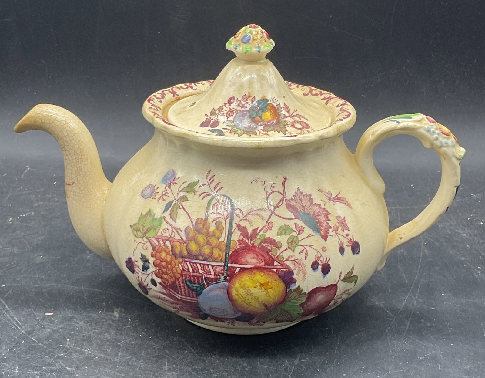 Vintage Masons Ironstone Fruit Teapot England: Vintage Masons ironstone teapot. Fruit basket pattern. Made in England. Measures approx. 9 x 5.5 x 6 inches. Wear including crazing and scratching, small chip. Masons teapot, ironstone teapot, fruit t