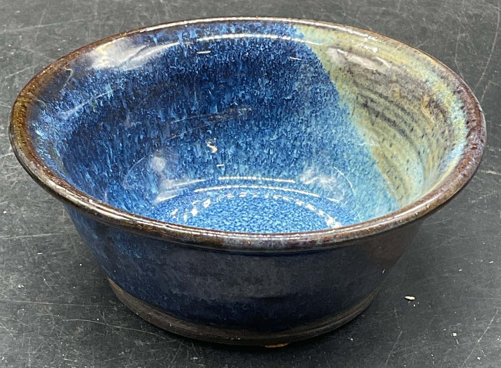 Signed Studio Pottery Blue Drip Glaze Bowl: Signed handmade studio pottery bowl with blue drip glaze. Signed illegibly. Measures approx. 5 x 2 inches. Some scratching. Drip glaze bowl, blue bowl, pottery bowl, home accessories, table accessorie