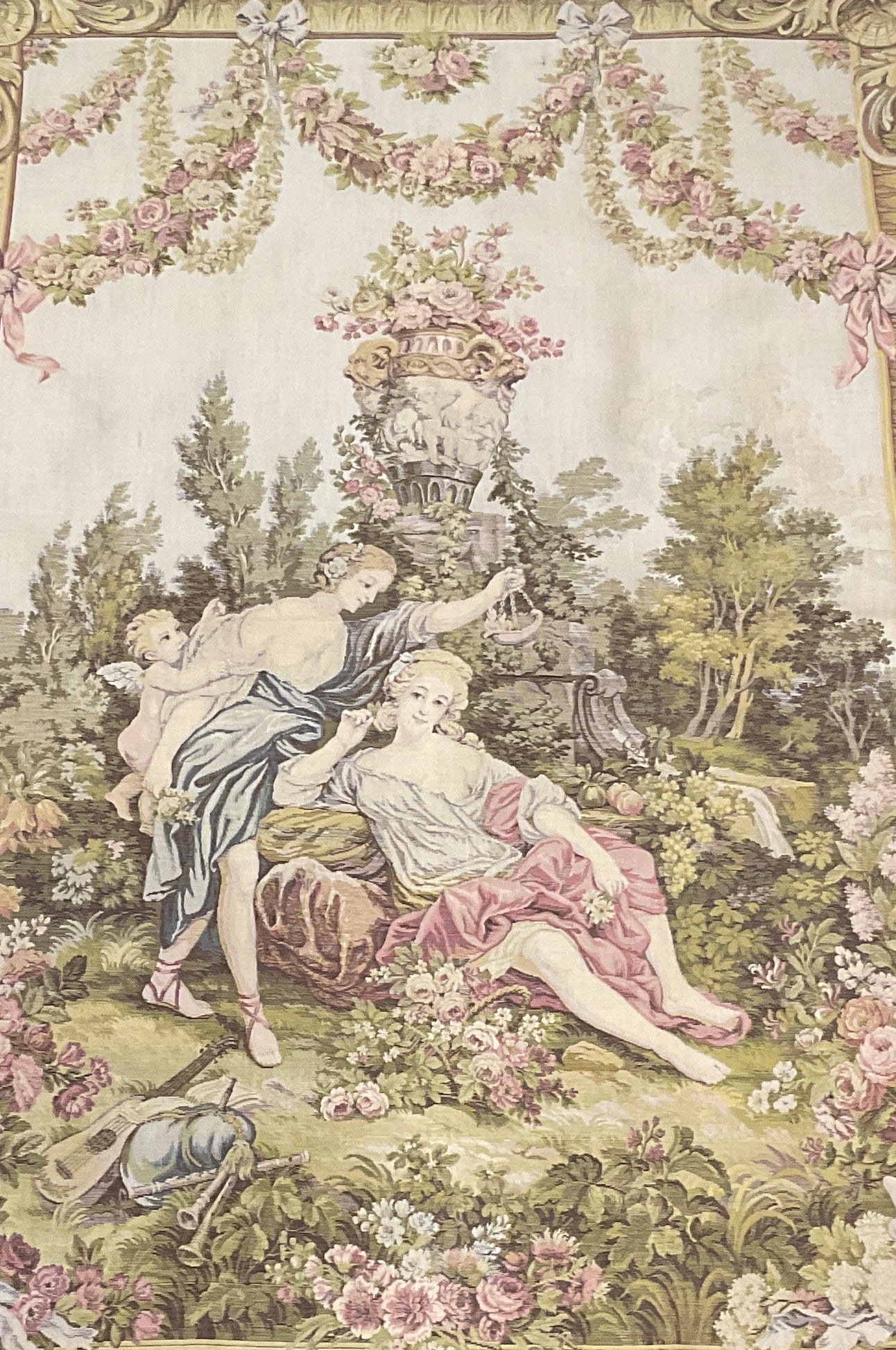 French Rococo Style Romantic Scene Tapestry 38in: Vintage French Rococo Style Romantic Scene Woven Fabric Tapestry. Features Two Figures Courting in a Garden Landscape with a Cherub Present. Some Fraying. Measures app 38.25in L x 27.5in W. Vintage Ta