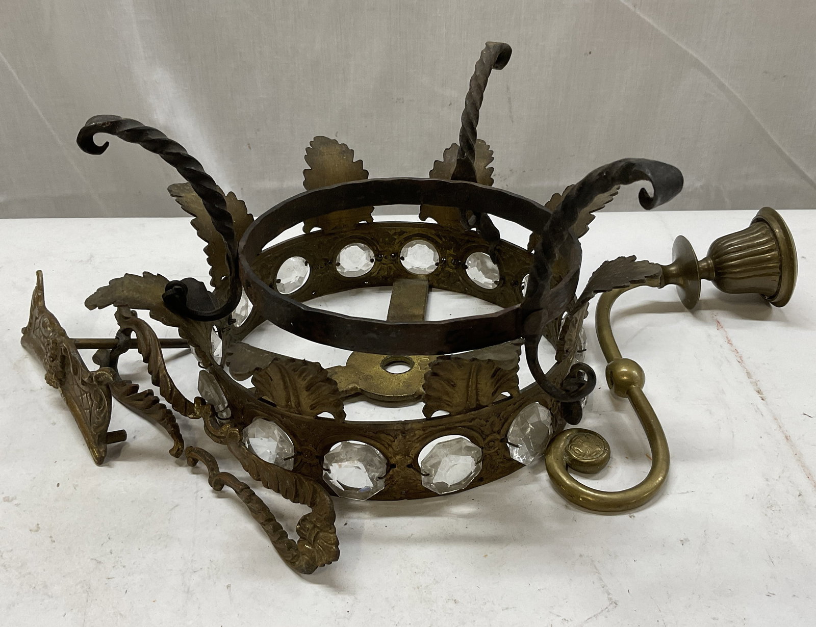 Lt 4 Pieces of VTG Brass & Iron Lighting Salvage: 4 Pieces of Vintage Brass & Iron Lighting Salvage. Includes a Brass Chandelier Crown with Decorative Leaf Elements and Crystals, a Wrought Iron Stand, a Brass Candelabra Piece with Intricate Scrollwor