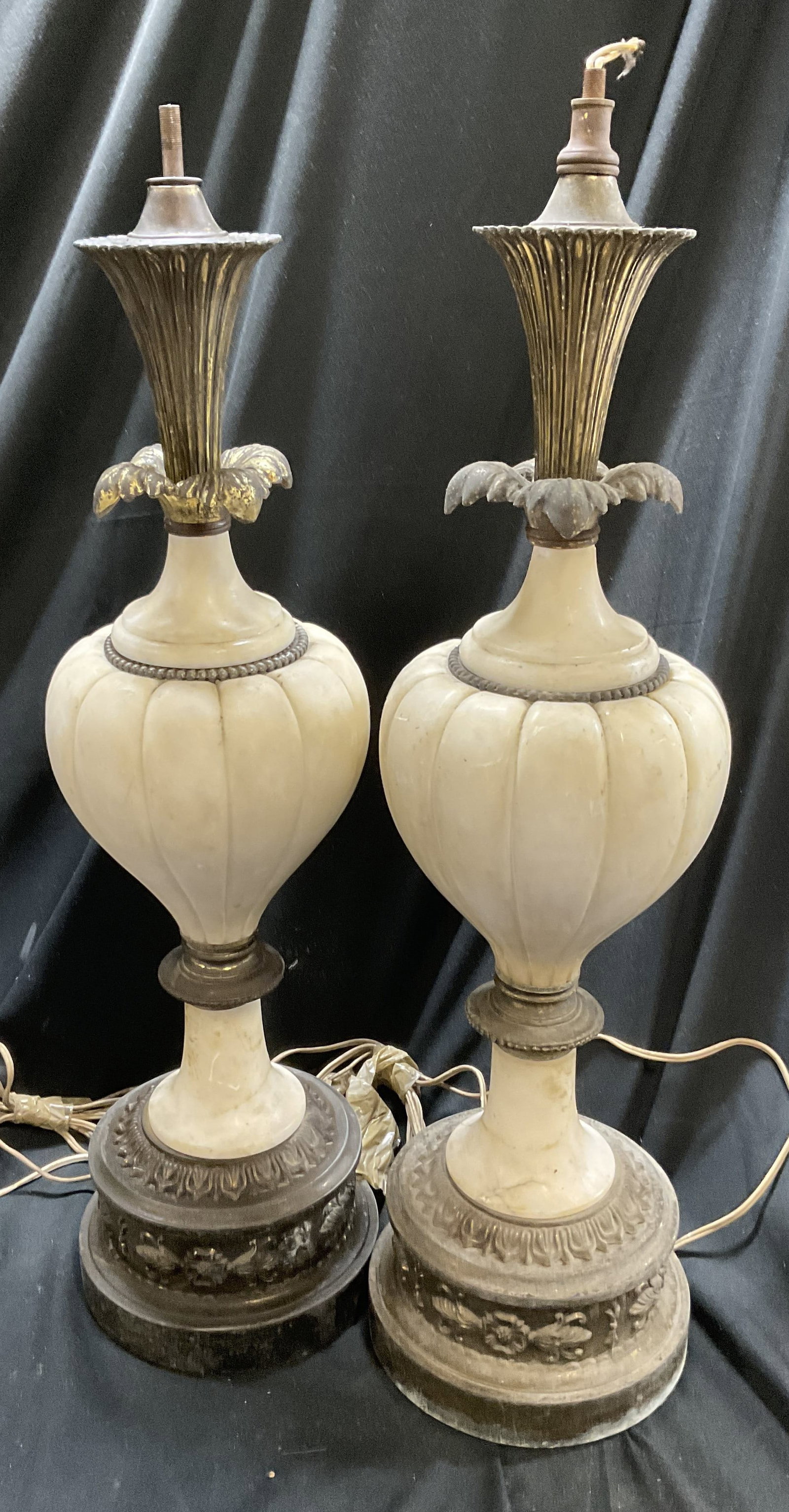 Pair Vintage Polished White Stone & Brass Lamps: Pair of Vintage Polished White Stone Lamps with Brass Base and Accents. Onion-Shaped Silhouettes. Have Significant Weight. Some Losses Such as Missing Pieces, Scratches, and Tarnishing. Some Loose Pie