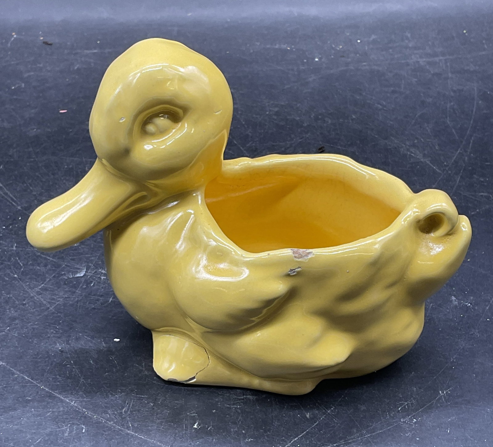 Vintage Yellow Ceramic Duck Planter: Vintage yellow ceramic duck motif planter. Measures approx. 5.75 x 3.25 x 4.25 inches. Some crazing, chips, and previous repair. Vintage planter, animal planter, home decor, home accessories, table de