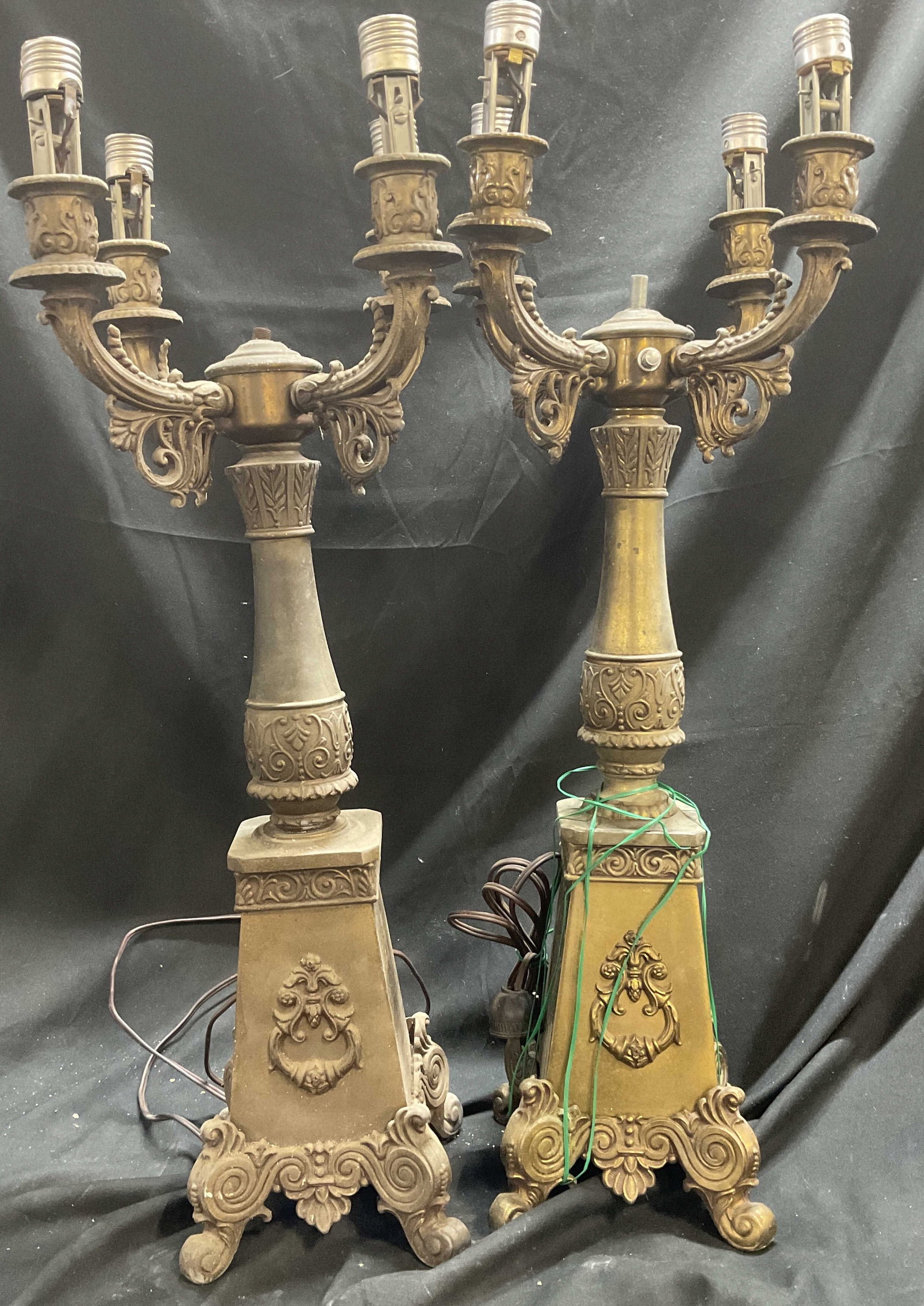 Pr Antique French-Style Brass Candelabra Lamps 25i: Pair of Antique French-Style Brass Candelabra Table Lamps. Four Arms. Scroll Design. Curved Feet. Scratching and Aging to Metal. Base Loose on One. Have Not Been Tested For Functionality. Measures app